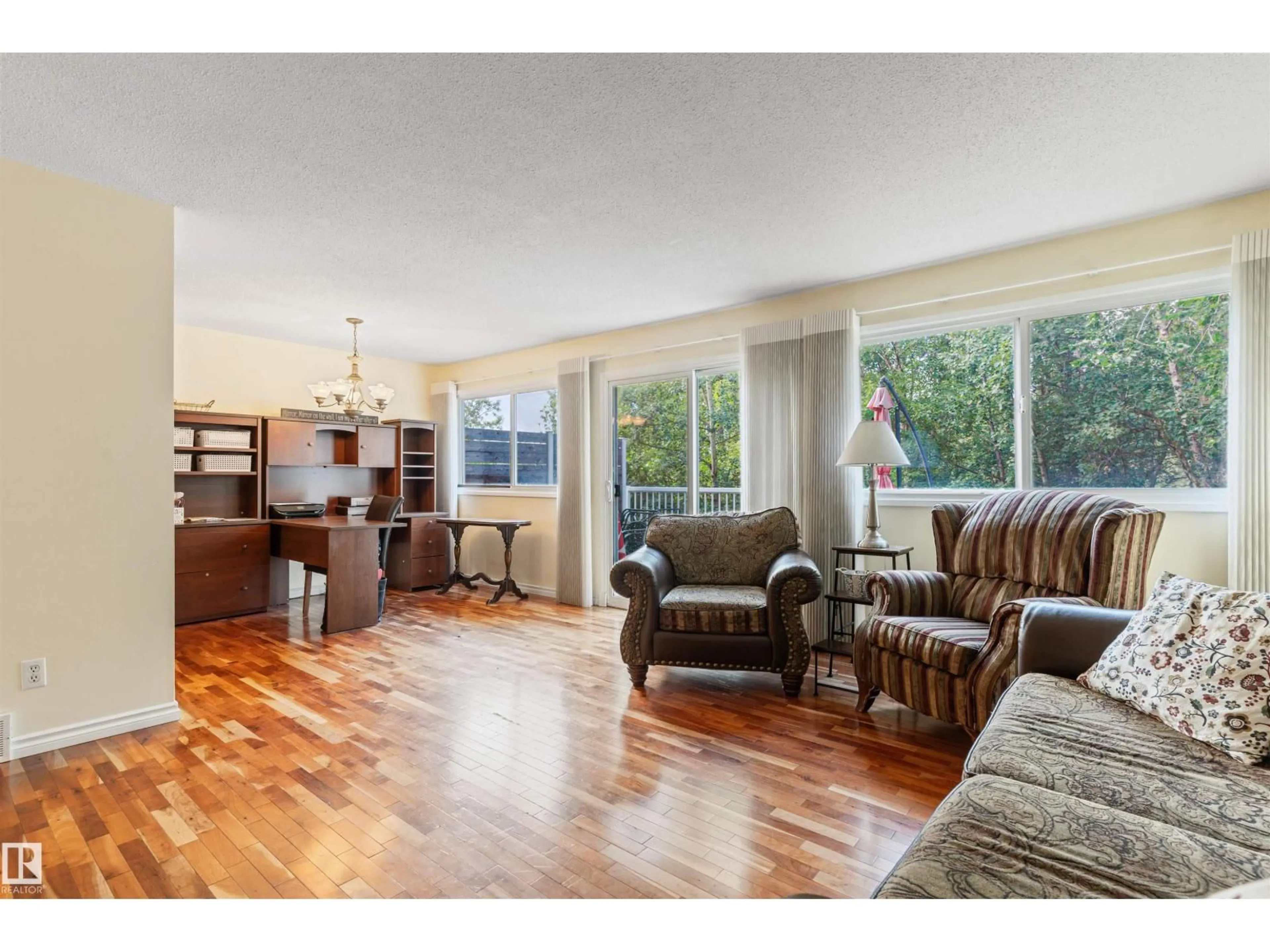 Living room with furniture, wood/laminate floor for 31 ROYAL RD, Edmonton Alberta T6J2E7