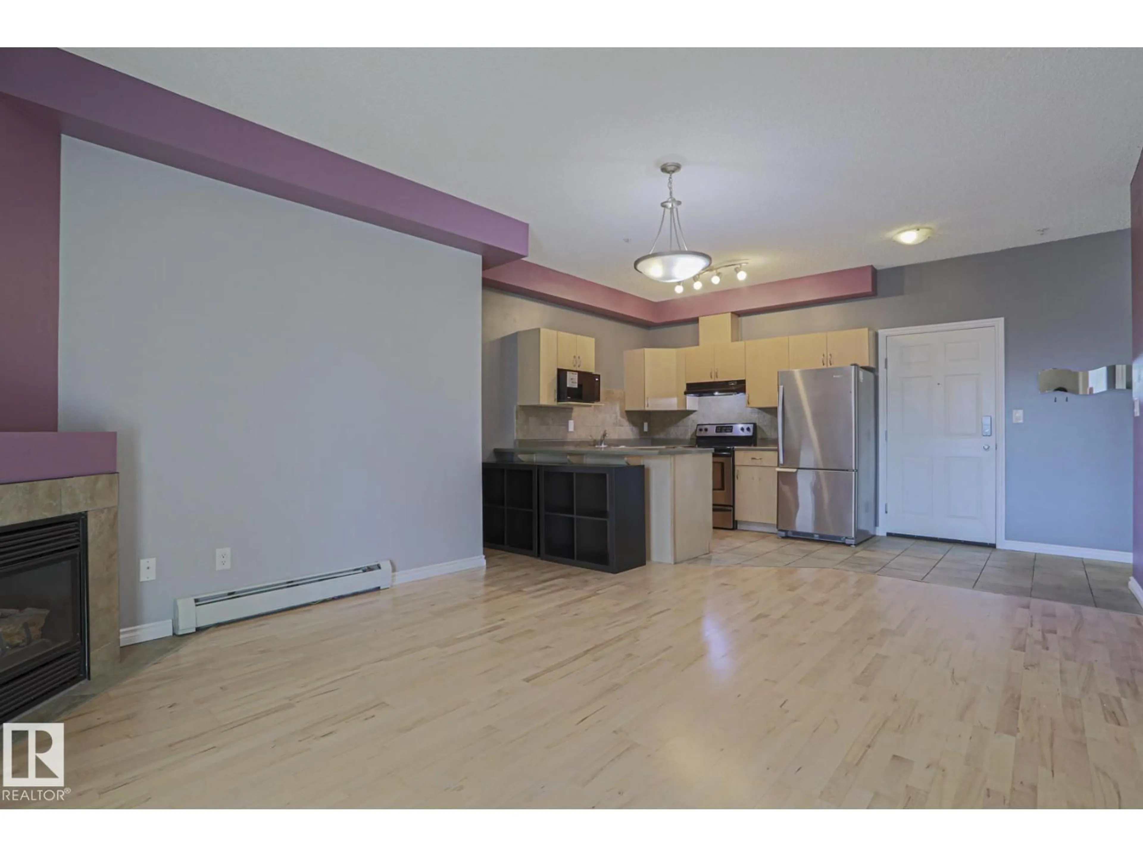 Open concept kitchen, wood/laminate floor for #101 - 10118 95 ST NW, Edmonton Alberta T5H4R6