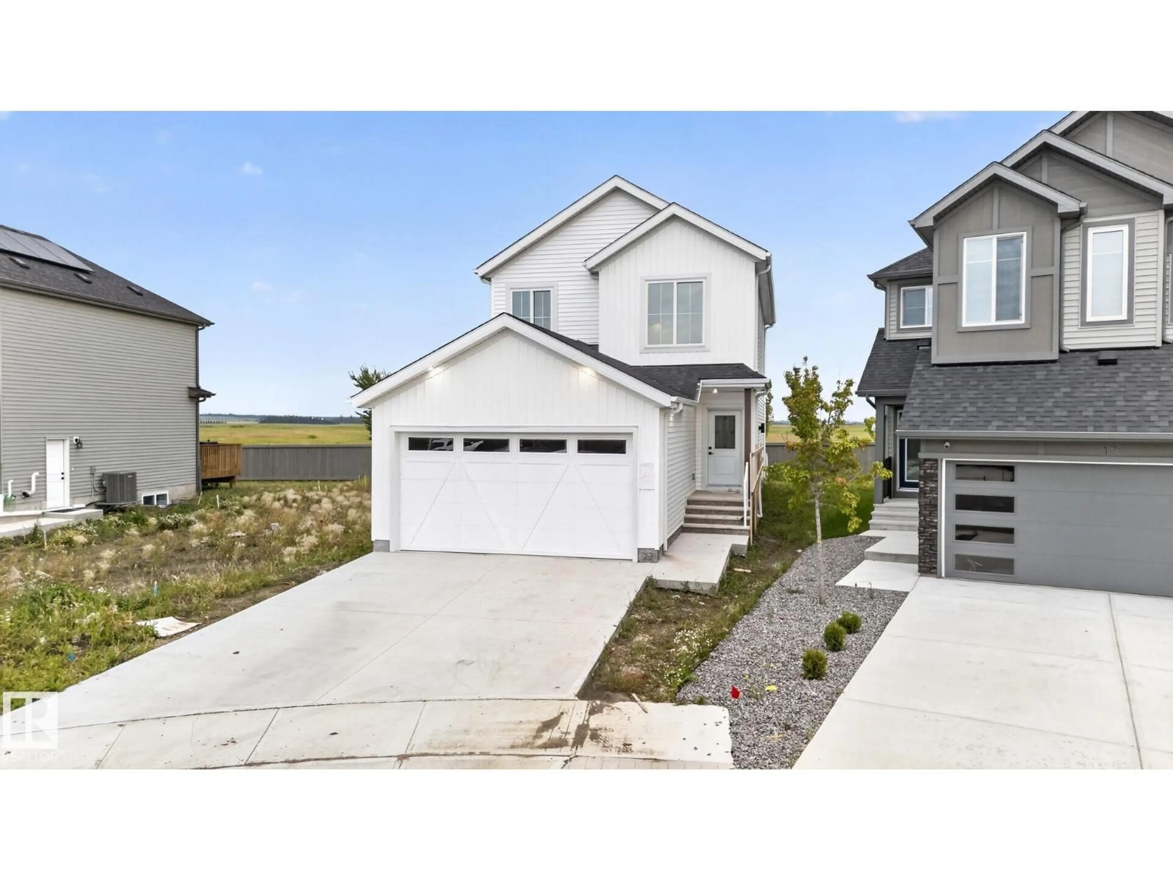 Home with vinyl exterior material, street for 13 ENNS CT, Fort Saskatchewan Alberta T8L0Z4