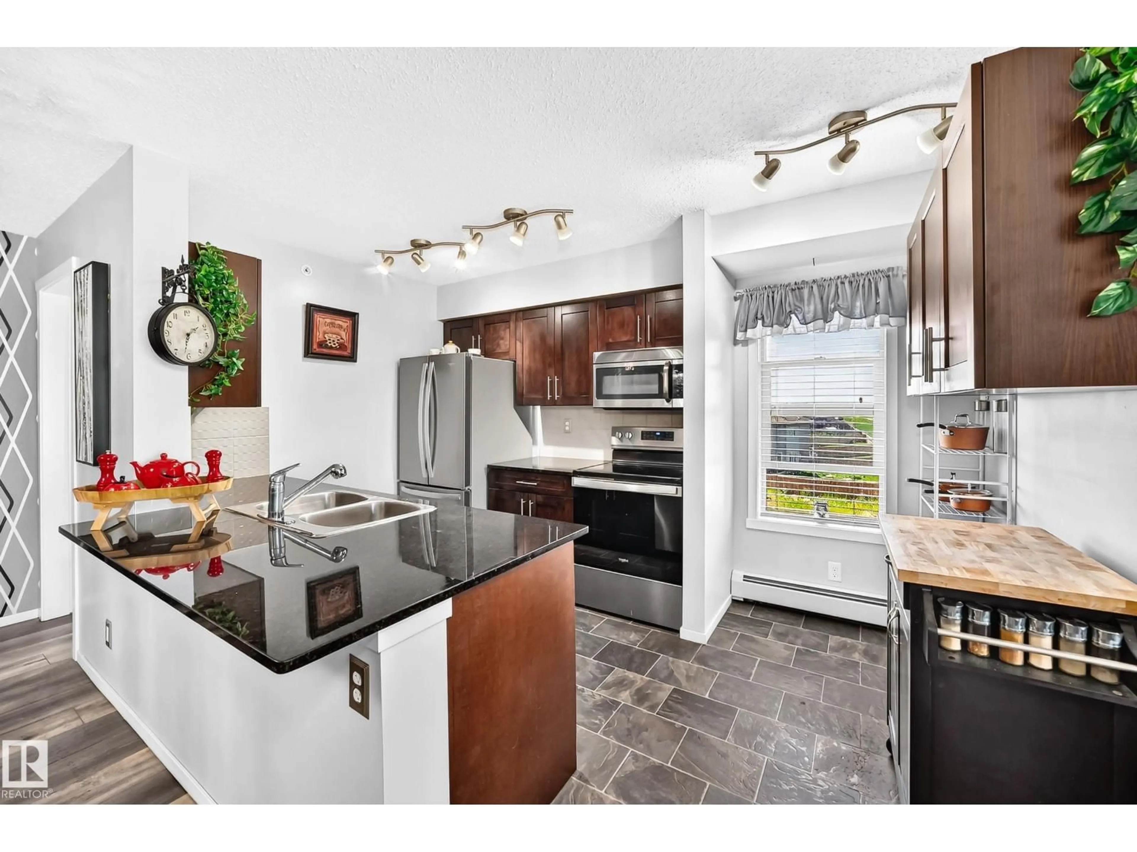 Open concept kitchen, ceramic/tile floor for #401 - 5390 CHAPPELLE RD, Edmonton Alberta T6W3K7