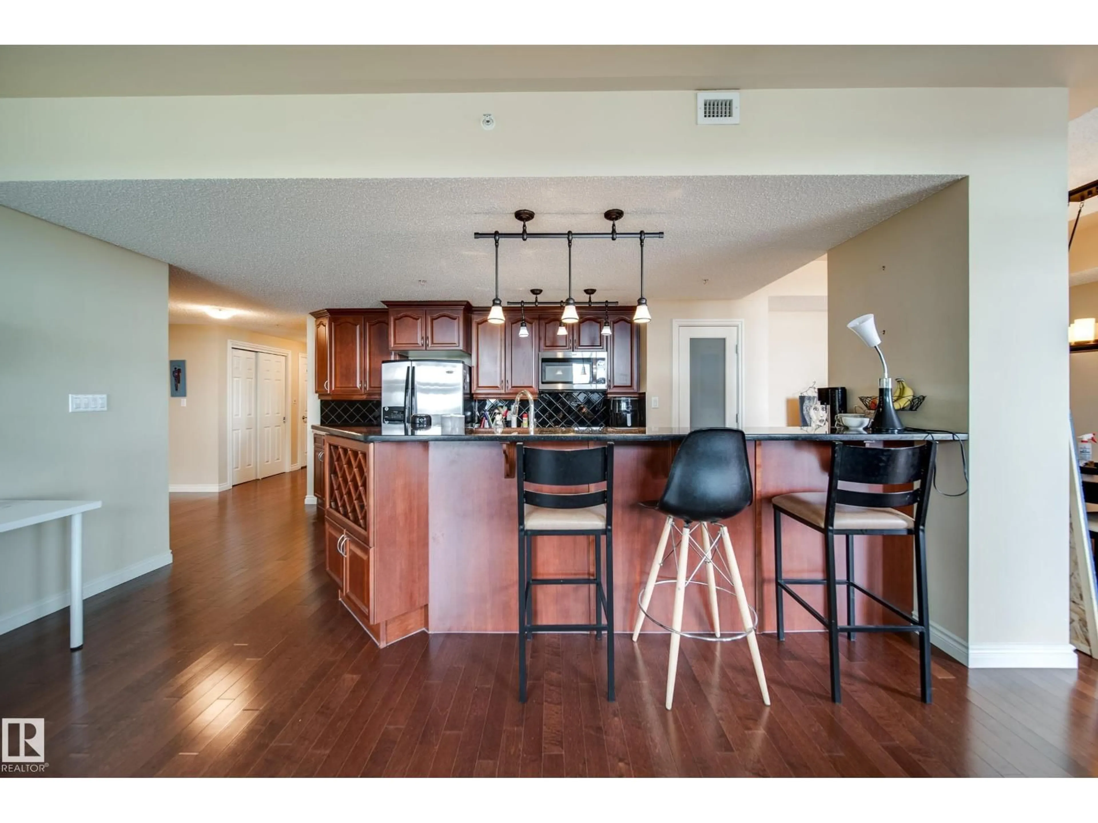 Open concept kitchen, wood/laminate floor for #1301 - 1301 JASPER AV, Edmonton Alberta T5H3S8