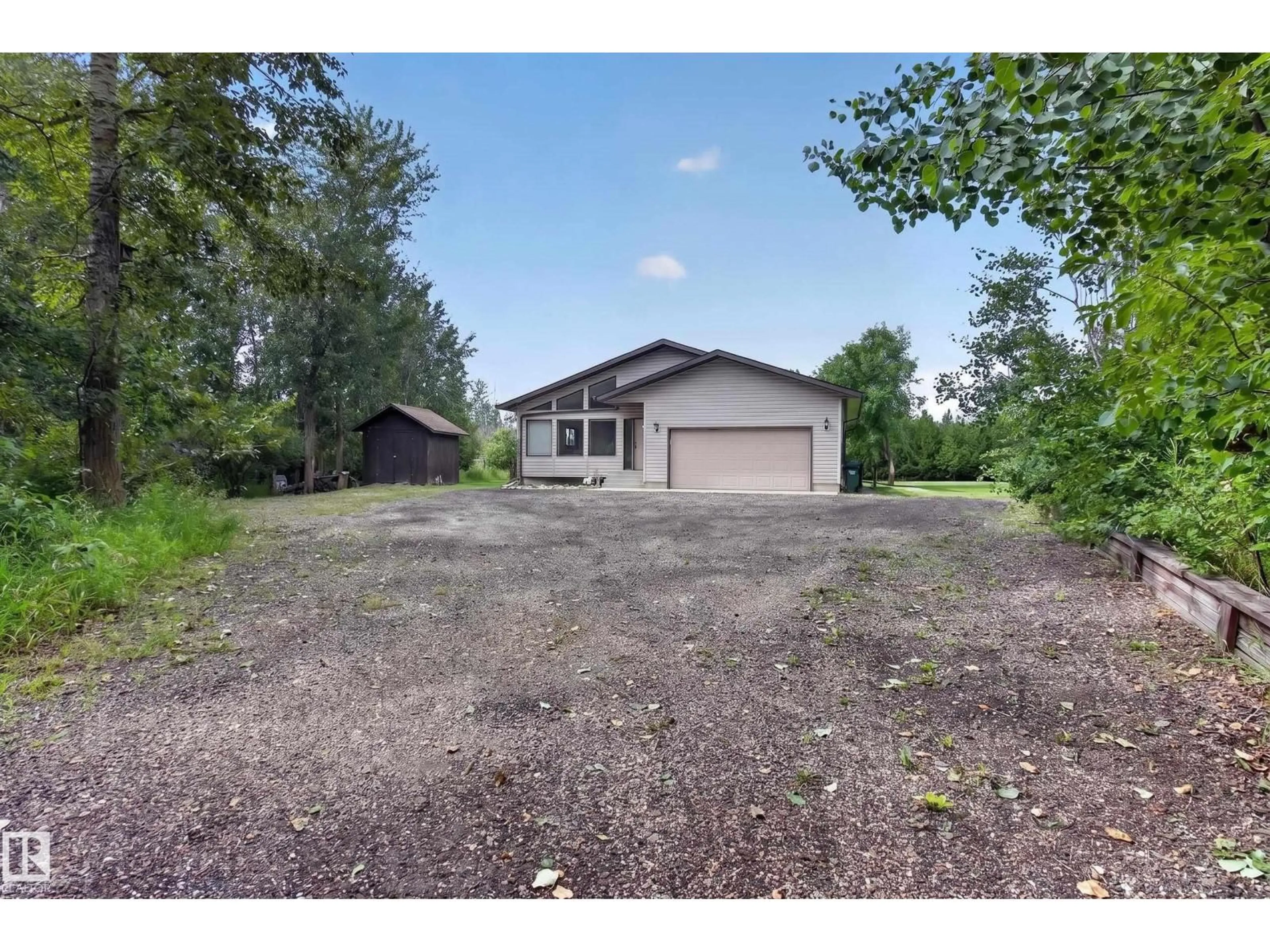 A pic from outside/outdoor area/front of a property/back of a property/a pic from drone, unknown for 217 - 22169 TWP ROAD 530, Rural Strathcona County Alberta T8E2J1