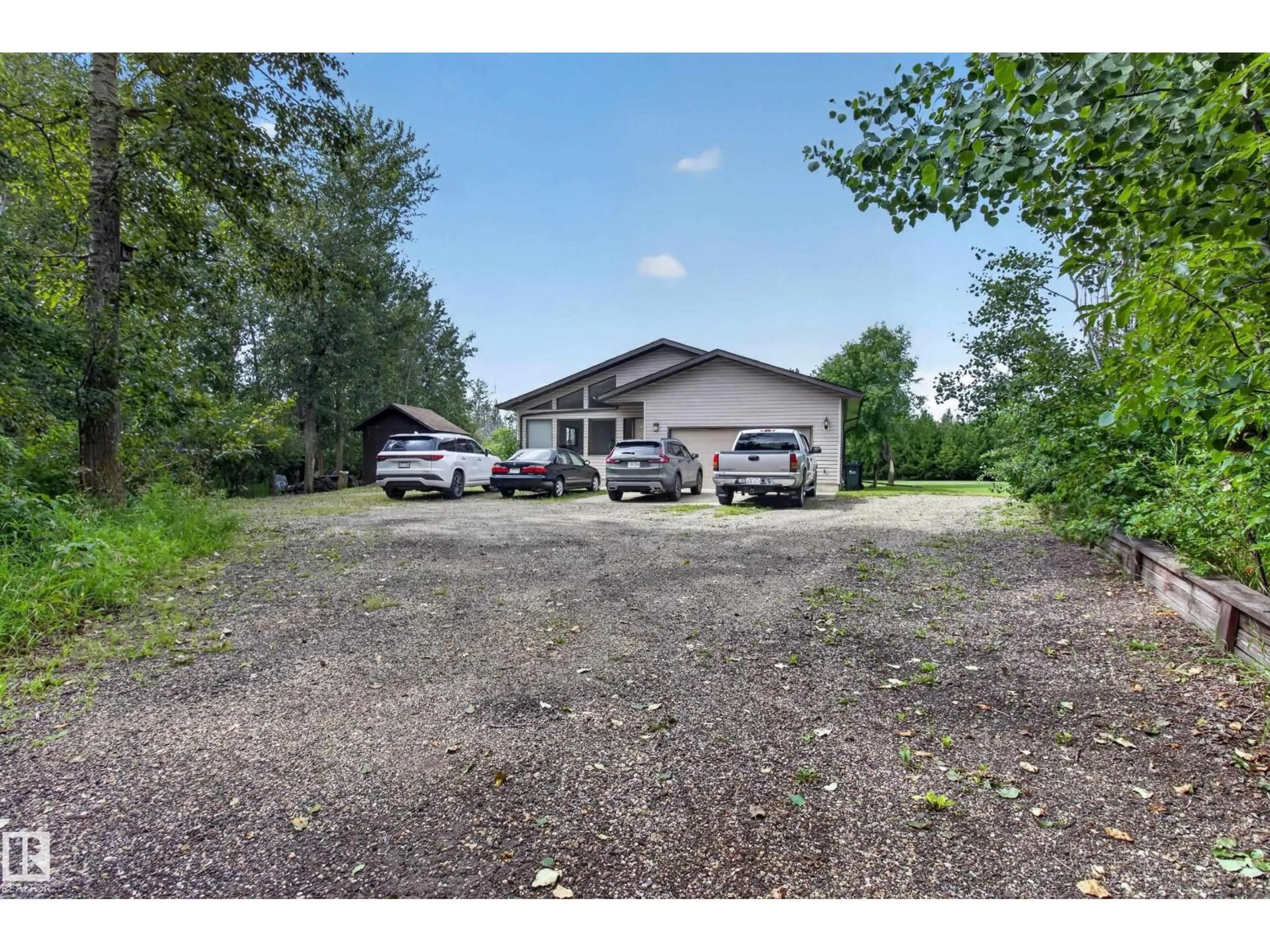 A pic from outside/outdoor area/front of a property/back of a property/a pic from drone, street for 217 - 22169 TWP ROAD 530, Rural Strathcona County Alberta T8E2J1