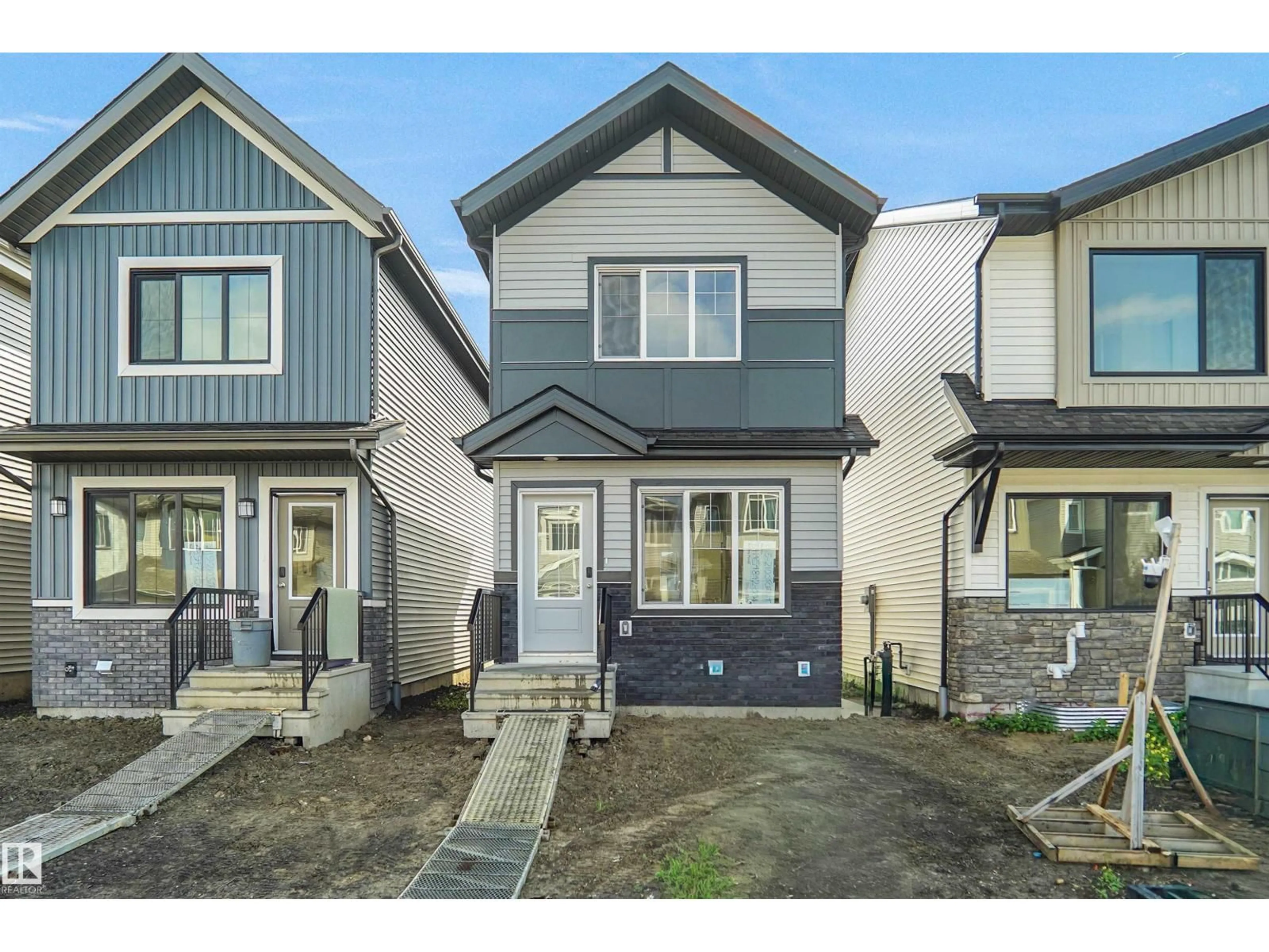 Home with vinyl exterior material, street for NW - 2115 210 ST, Edmonton Alberta T6M3H6