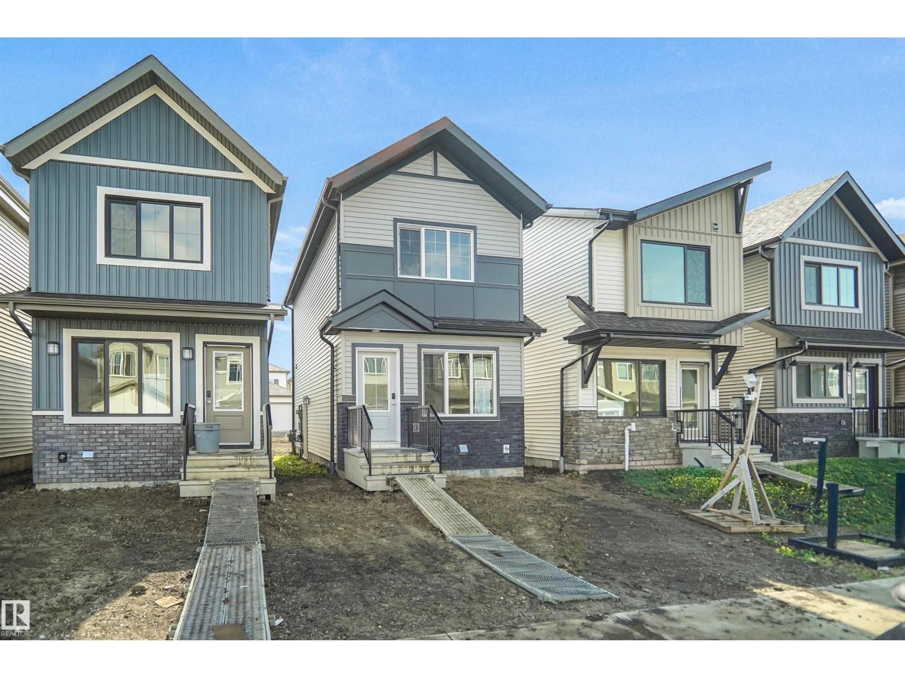 Home with vinyl exterior material, street for NW - 2115 210 ST, Edmonton Alberta T6M3H6