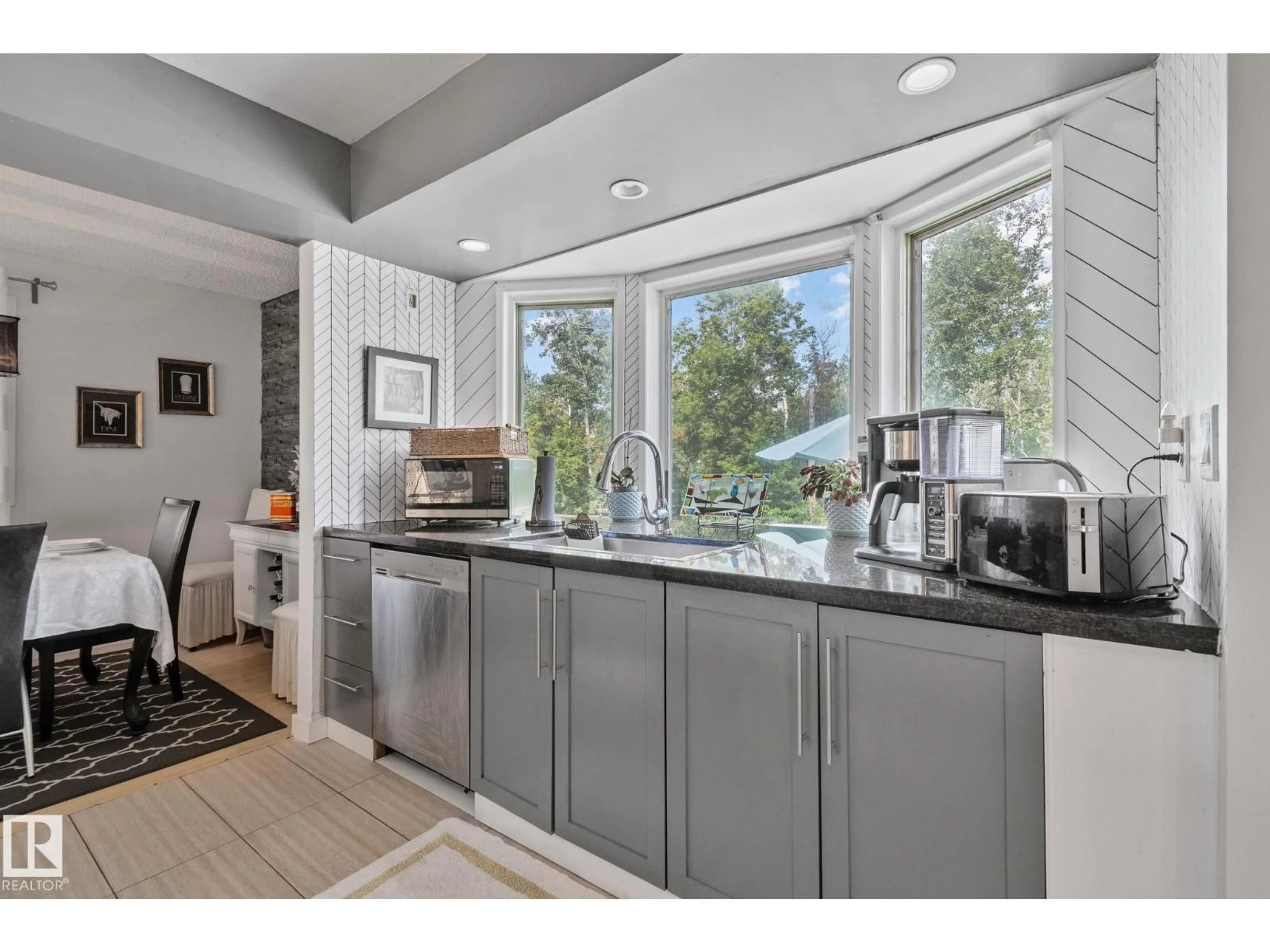 Open concept kitchen, ceramic/tile floor for 4682 17 AV, Edmonton Alberta T6L2R9