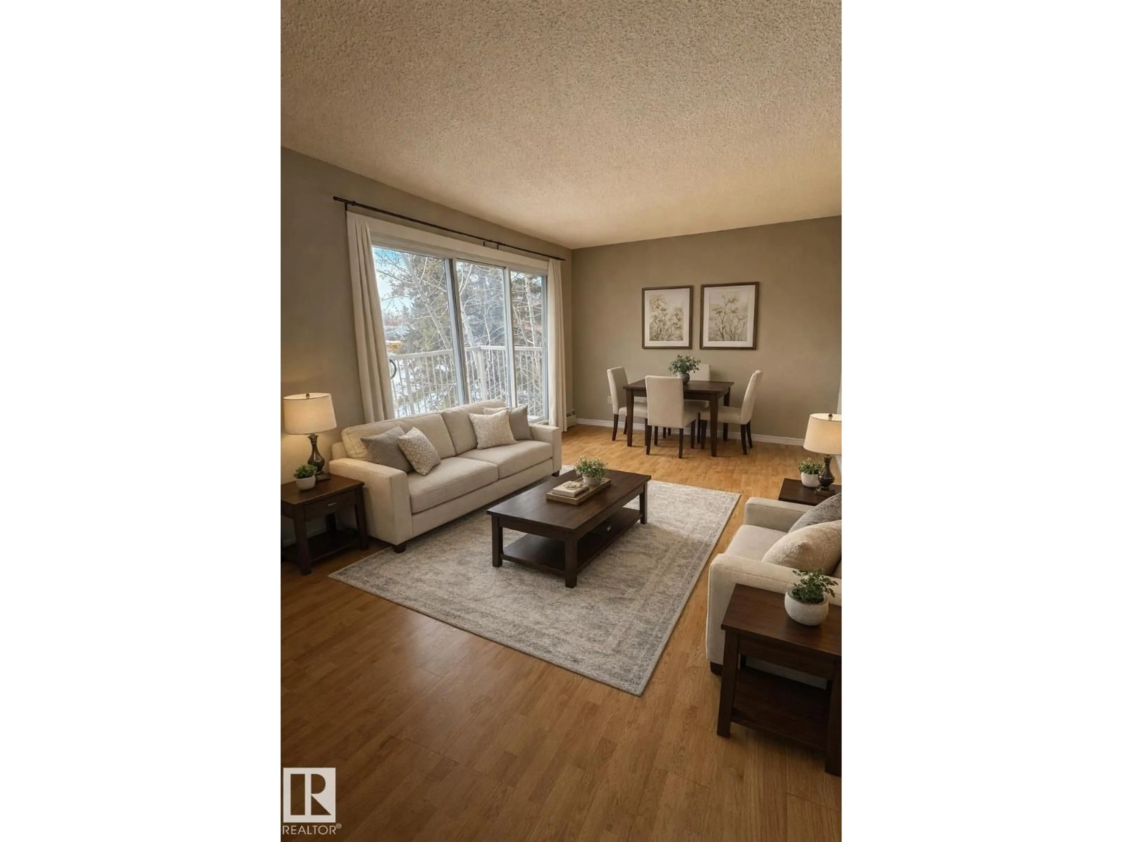 Living room with furniture, wood/laminate floor for 315 - 7220 144 AV, Edmonton Alberta T5C3E4