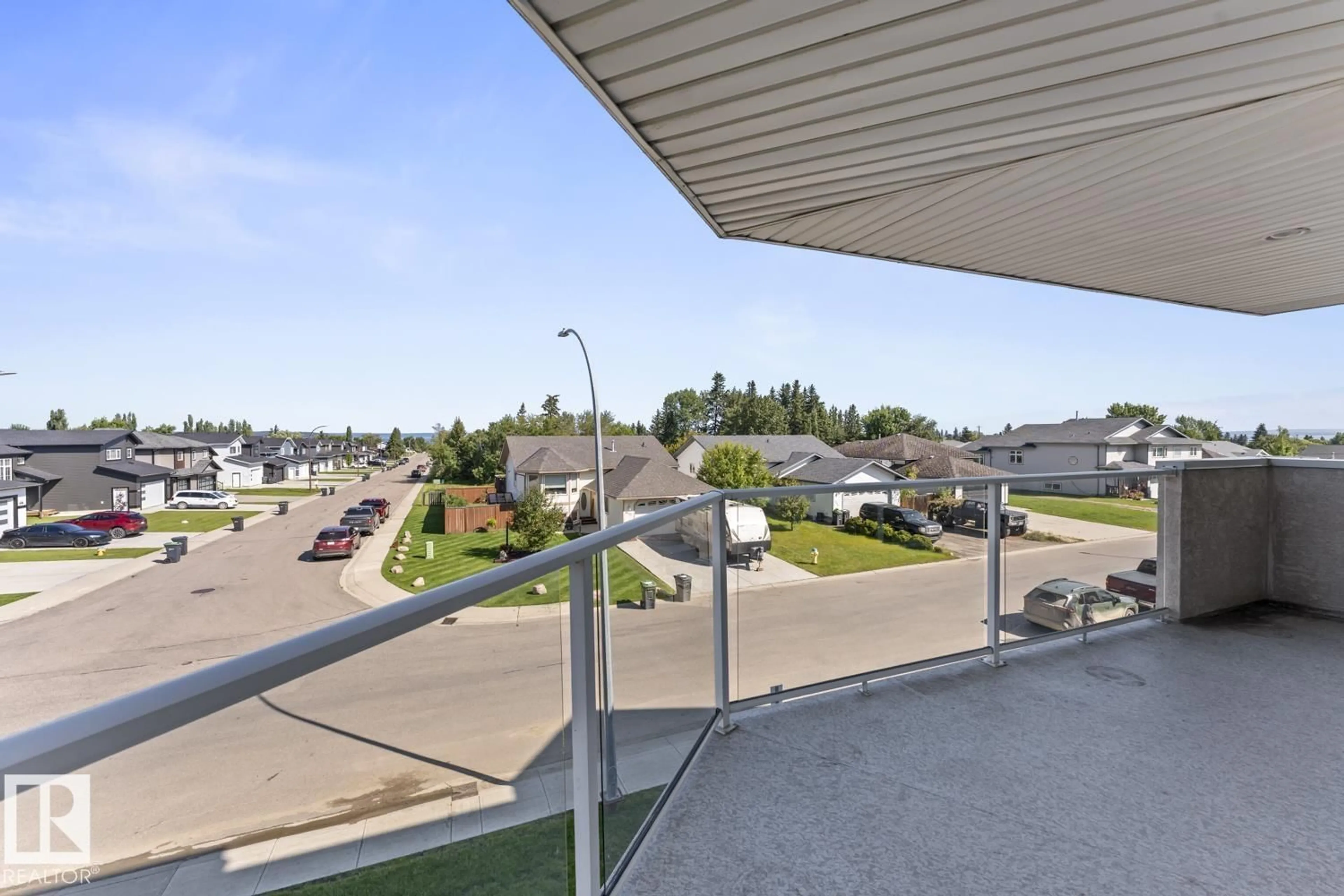 Patio, city buildings view from balcony for #201 - 1705 7 AV, Cold Lake Alberta T9M0A6