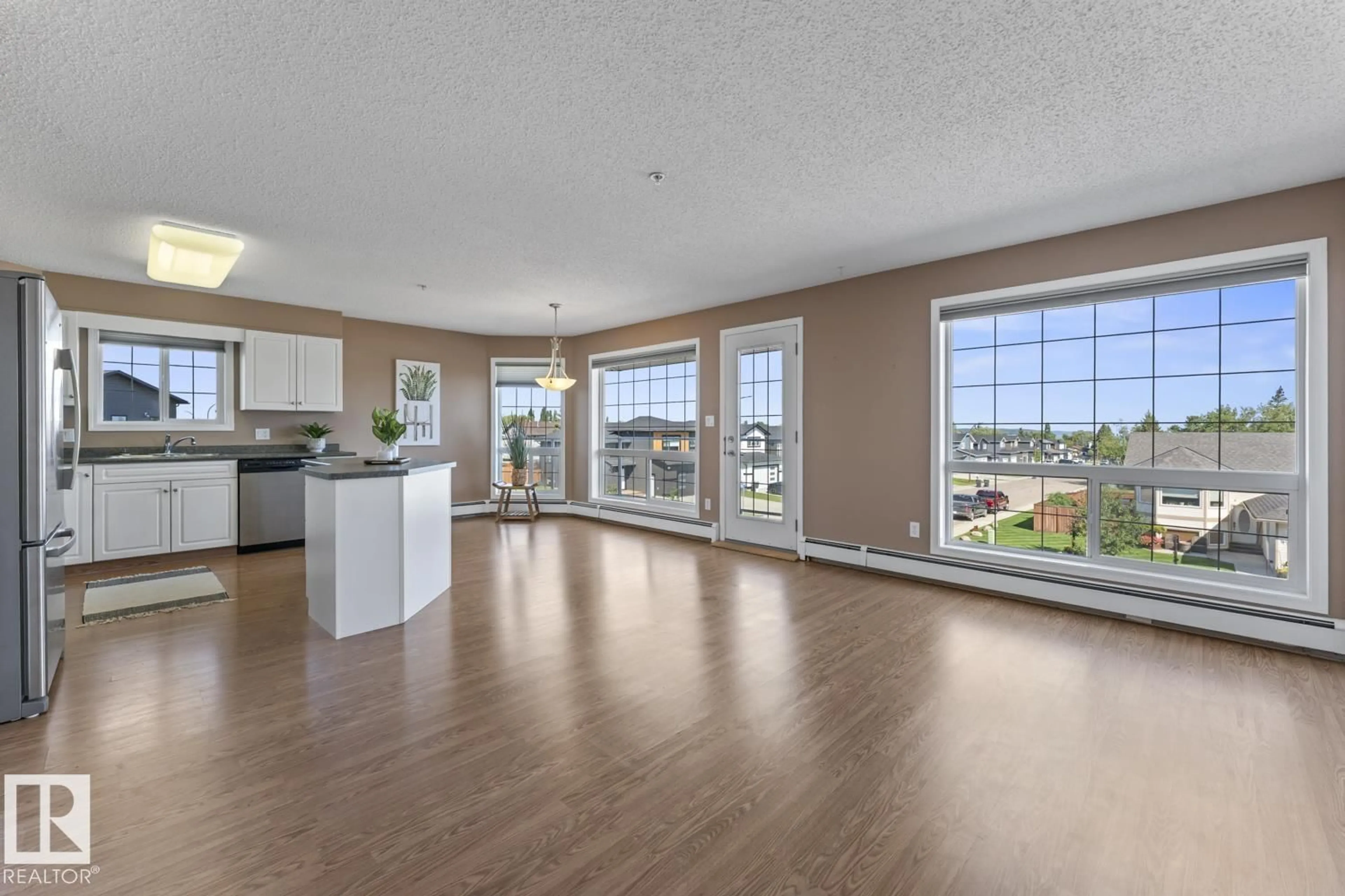 Open concept kitchen, wood/laminate floor for #201 - 1705 7 AV, Cold Lake Alberta T9M0A6