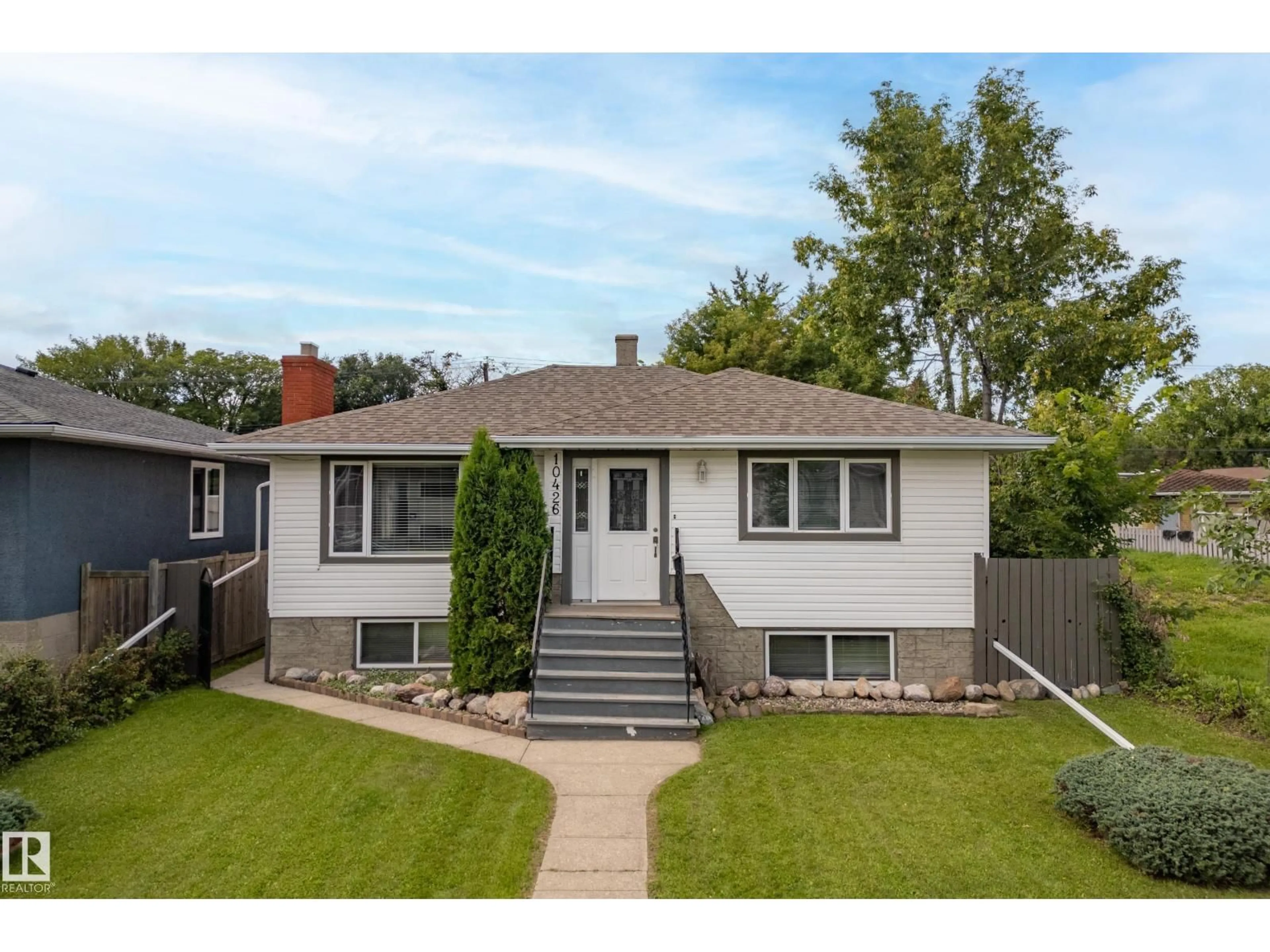 Home with vinyl exterior material, street for NW - 10426 79 ST, Edmonton Alberta T6A3G9