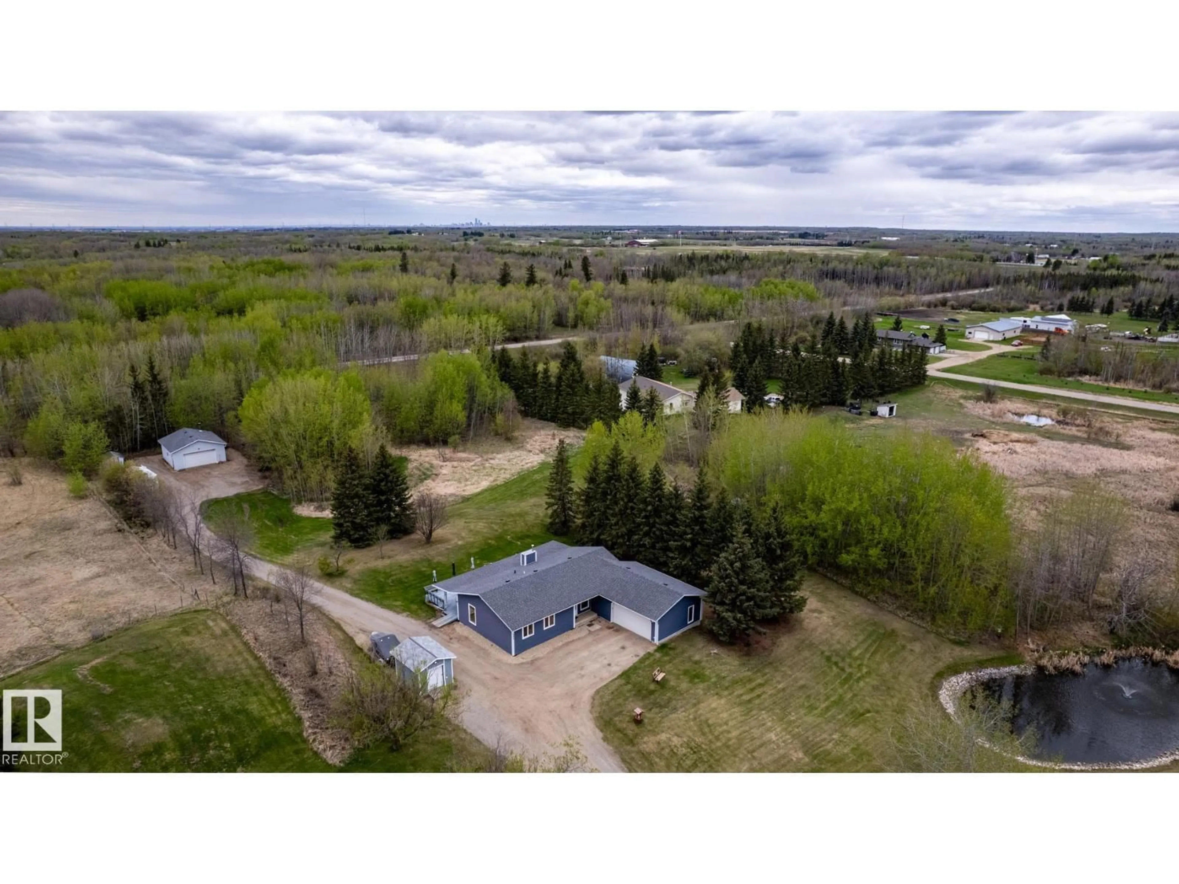 A pic from outside/outdoor area/front of a property/back of a property/a pic from drone, water/lake/river/ocean view for 229 22450 TWP ROAD 514, Rural Strathcona County Alberta T8C1H5