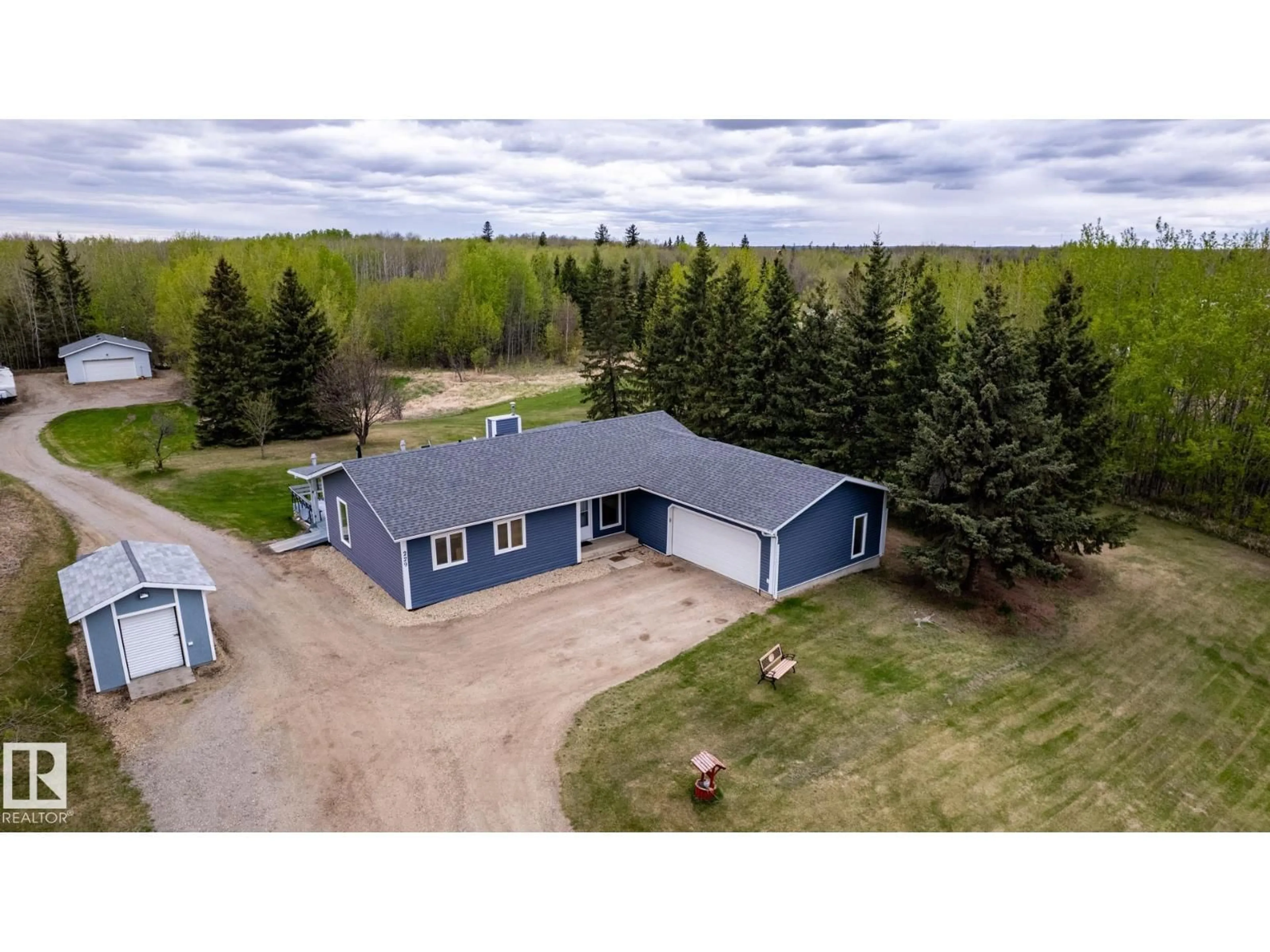 A pic from outside/outdoor area/front of a property/back of a property/a pic from drone, building for 229 22450 TWP ROAD 514, Rural Strathcona County Alberta T8C1H5