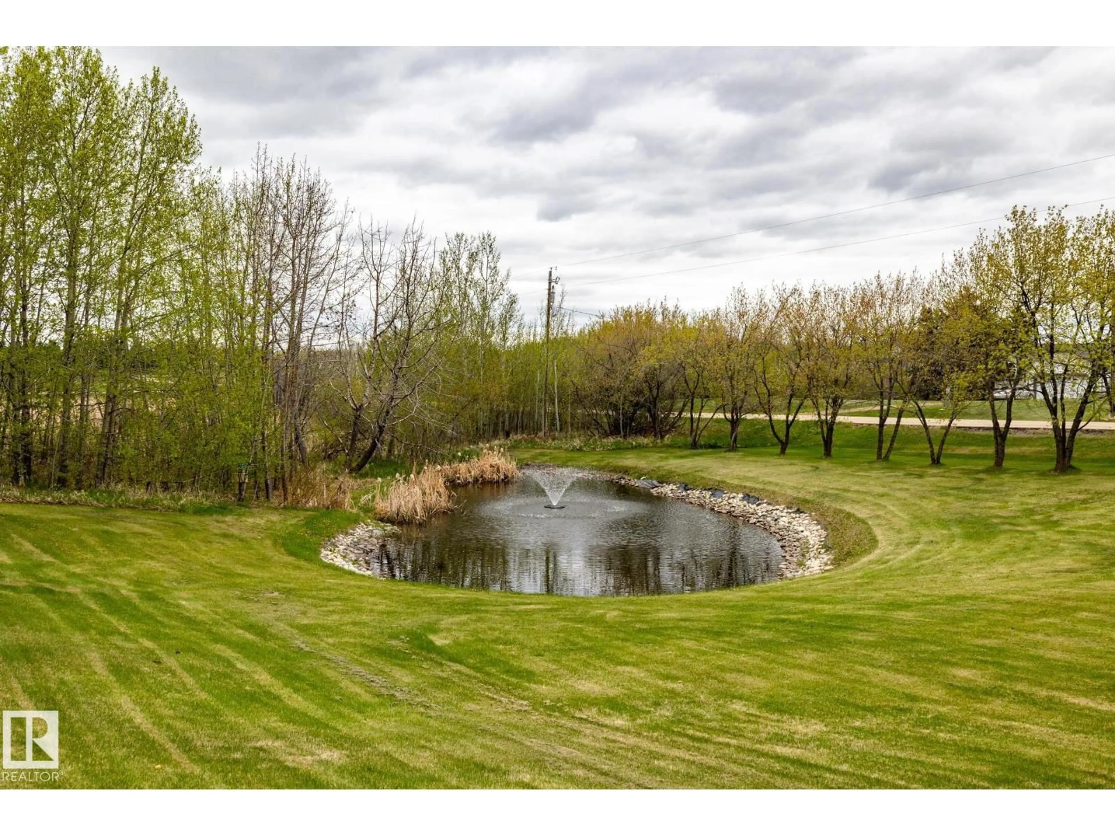 A pic from outside/outdoor area/front of a property/back of a property/a pic from drone, water/lake/river/ocean view for 229 22450 TWP ROAD 514, Rural Strathcona County Alberta T8C1H5