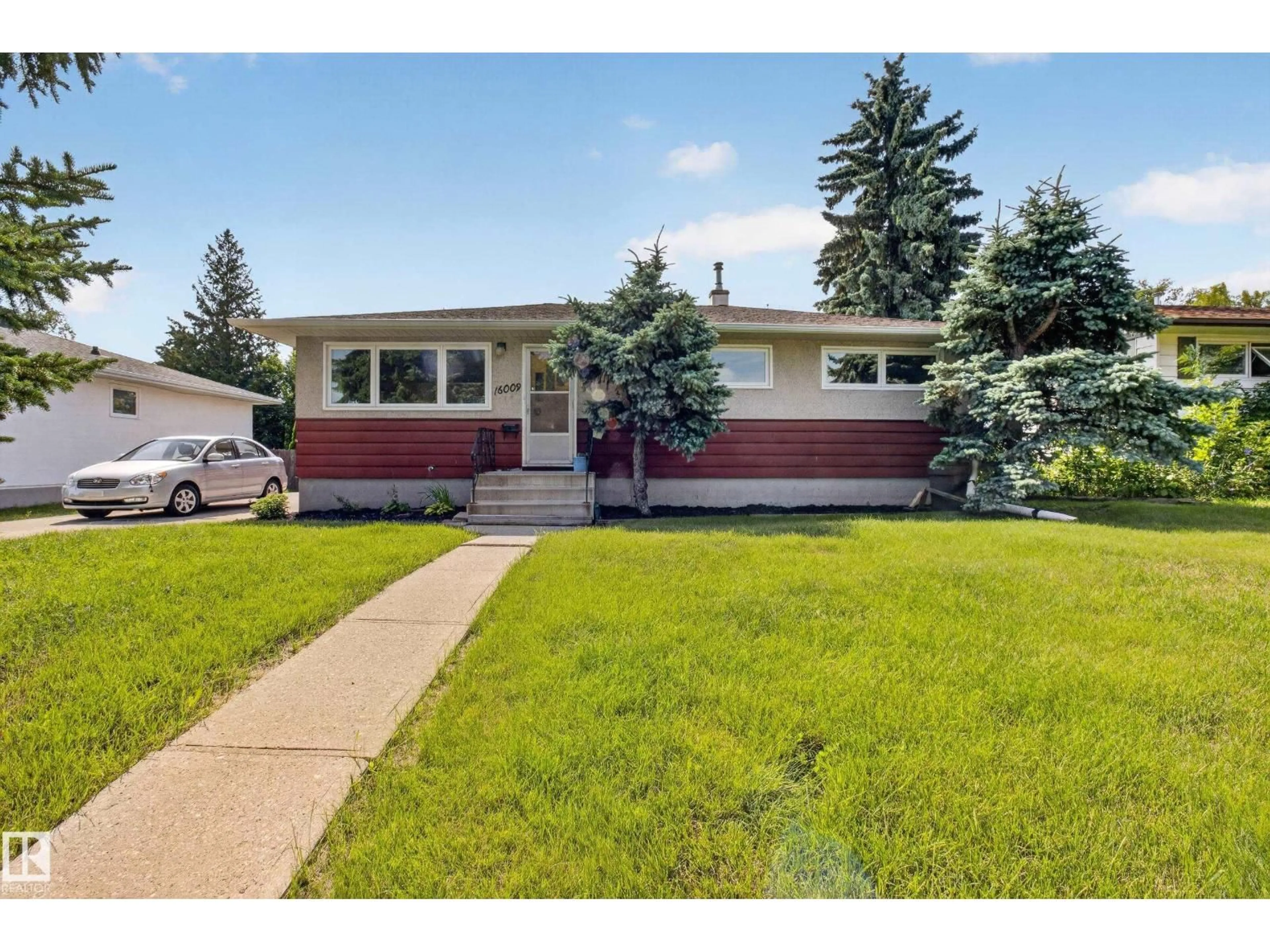 Home with vinyl exterior material, street for 16009 93A AV NW, Edmonton Alberta T5R5J7