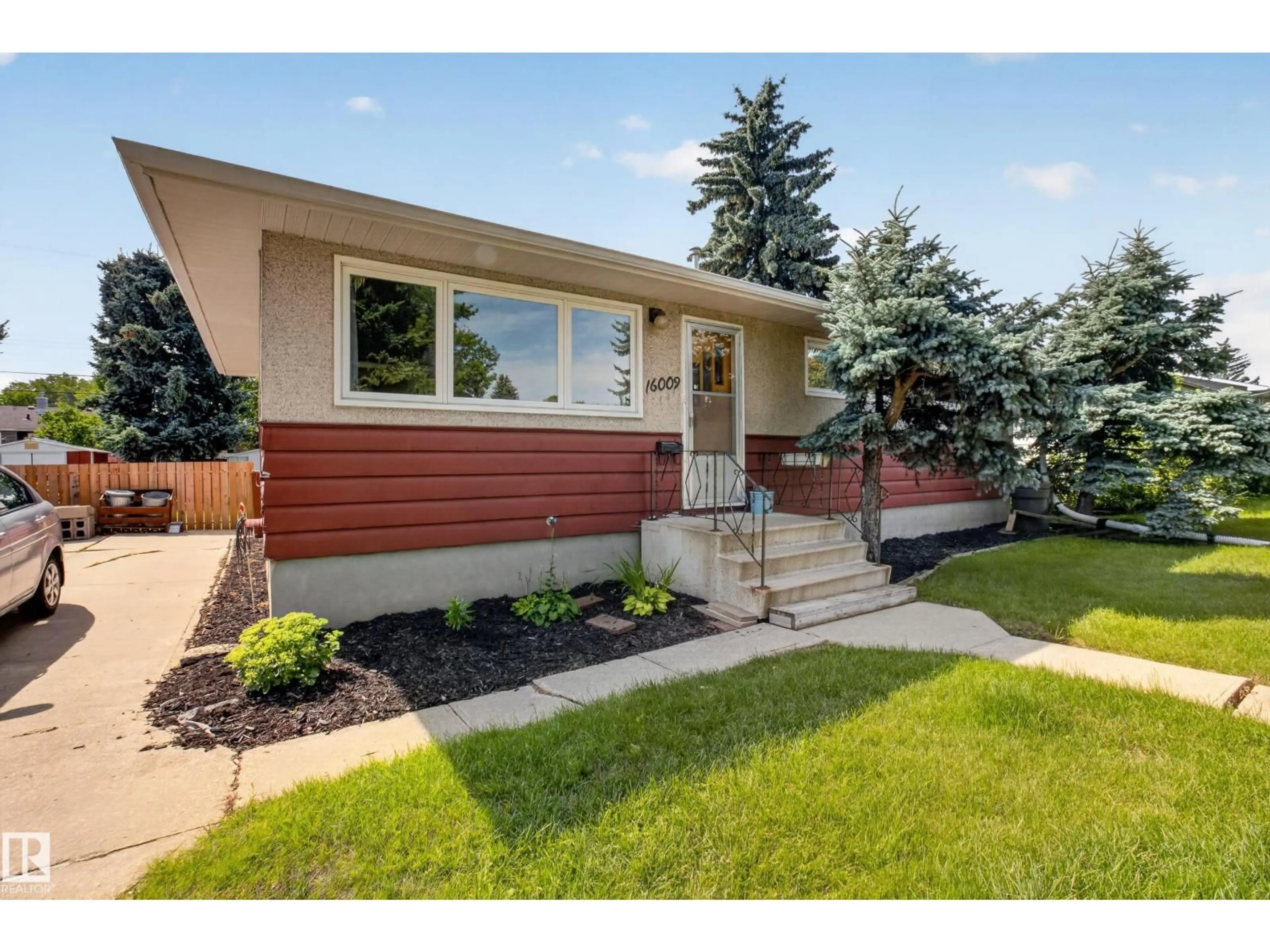 Home with vinyl exterior material, street for 16009 93A AV NW, Edmonton Alberta T5R5J7