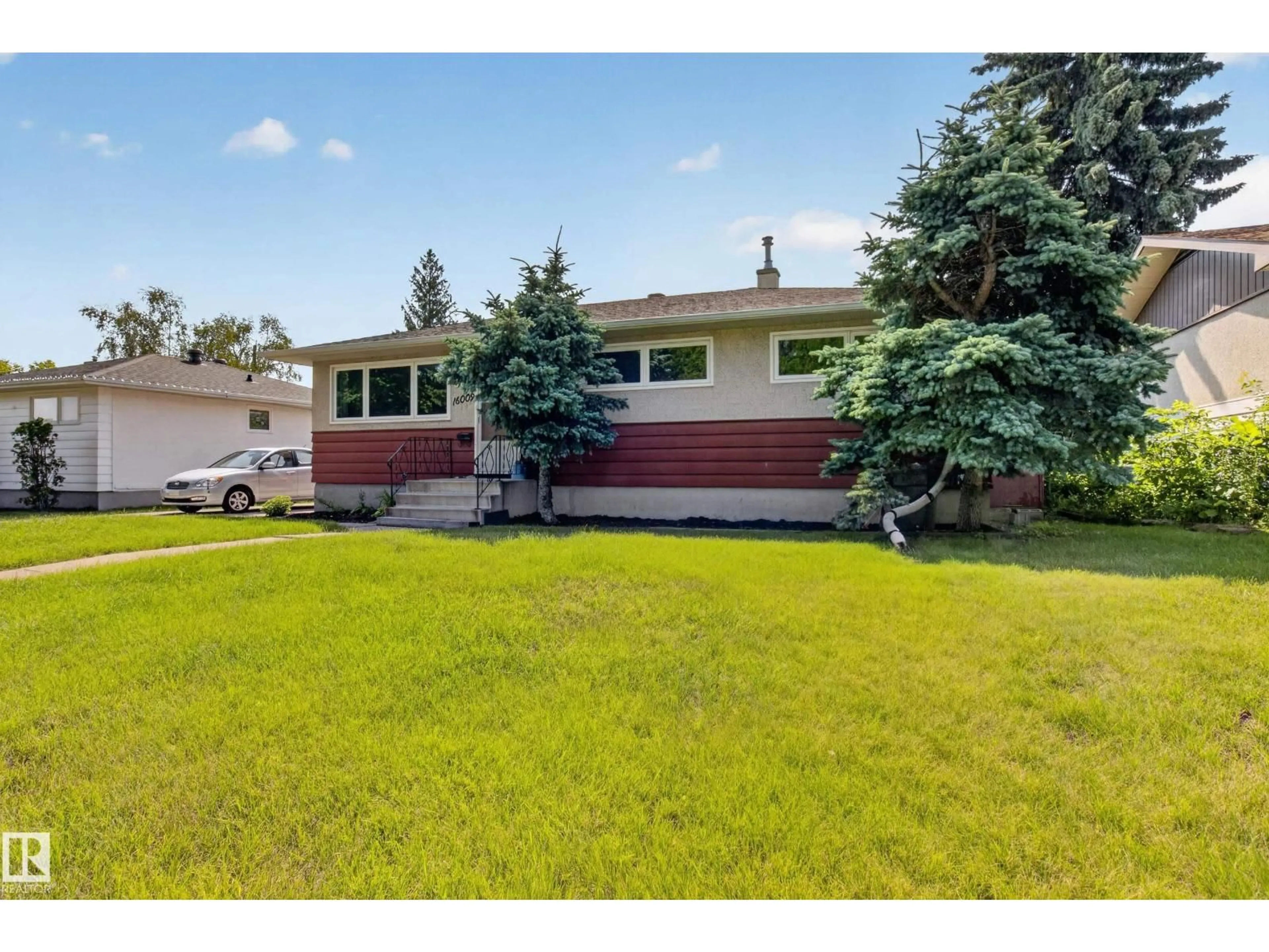Home with vinyl exterior material, street for 16009 93A AV NW, Edmonton Alberta T5R5J7