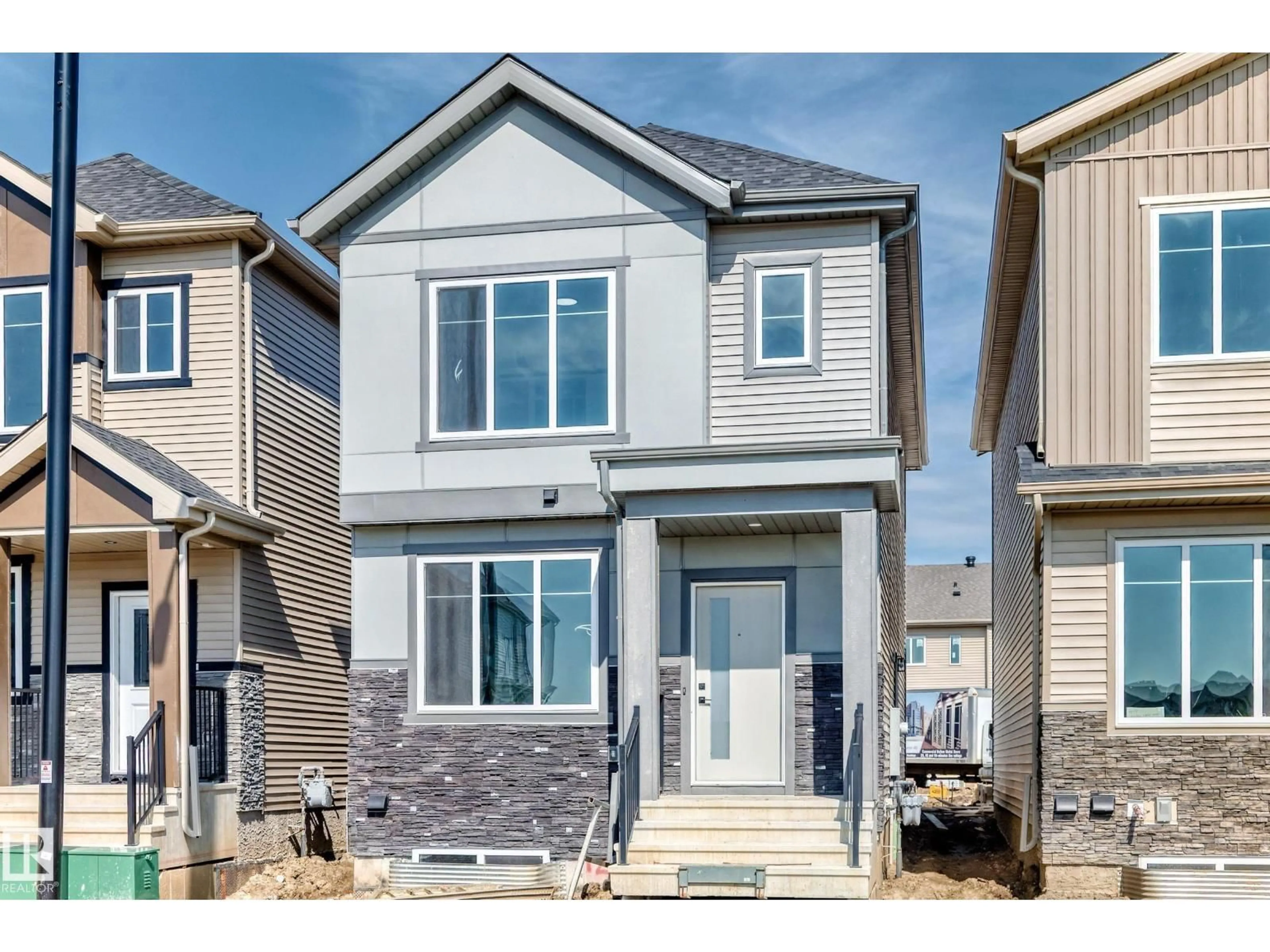 Home with vinyl exterior material, street for 426 CRYSTAL CREEK LI, Leduc Alberta T9E0X5