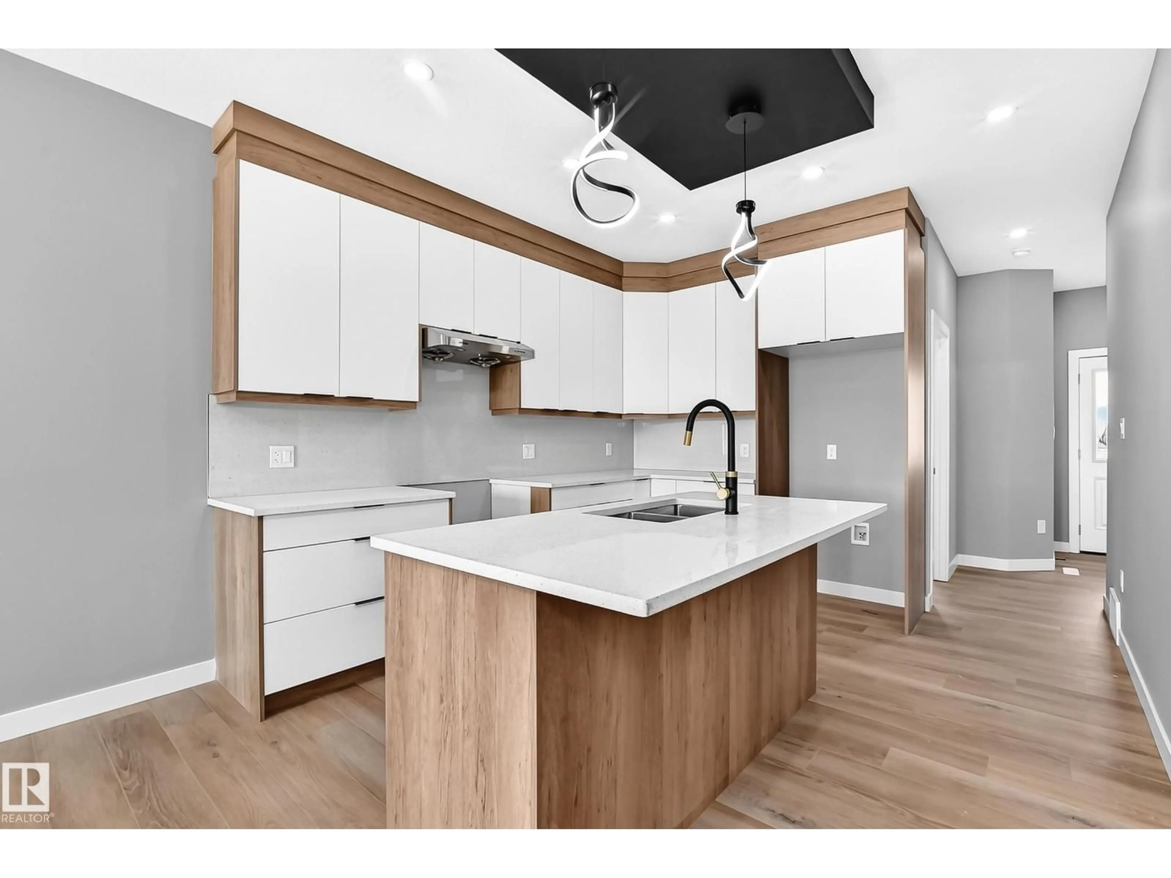 Open concept kitchen, wood/laminate floor for 426 CRYSTAL CREEK LI, Leduc Alberta T9E0X5