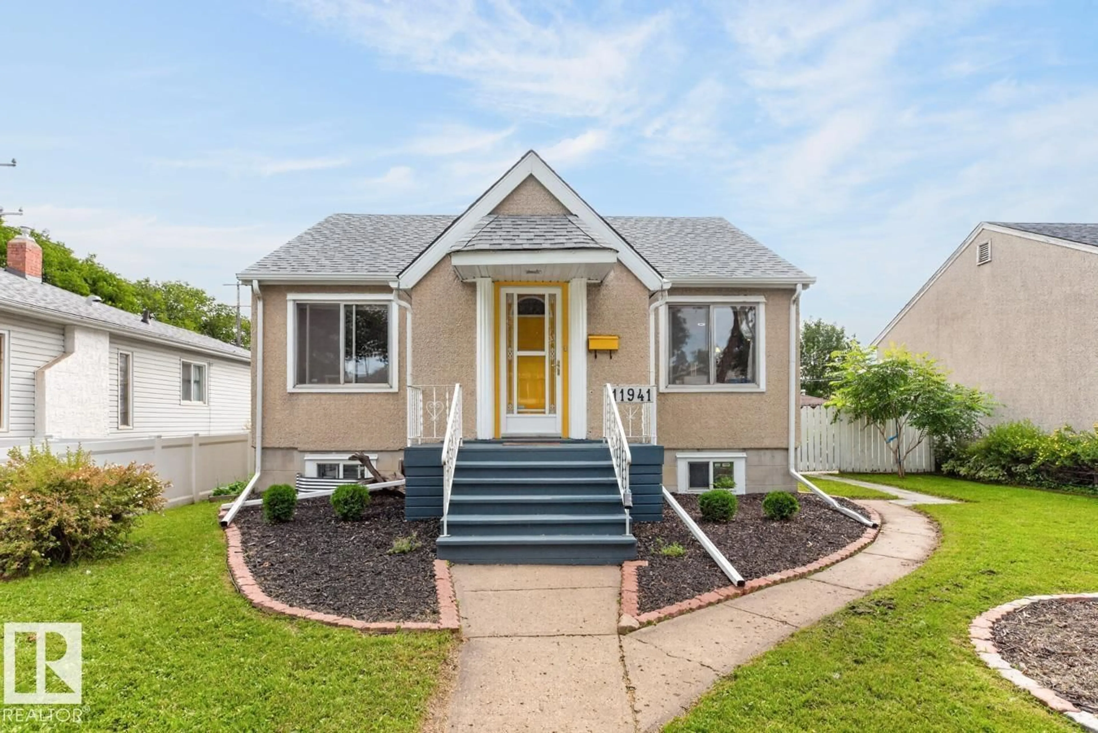 Home with vinyl exterior material, street for NW - 11941 83 ST, Edmonton Alberta T5B4E7