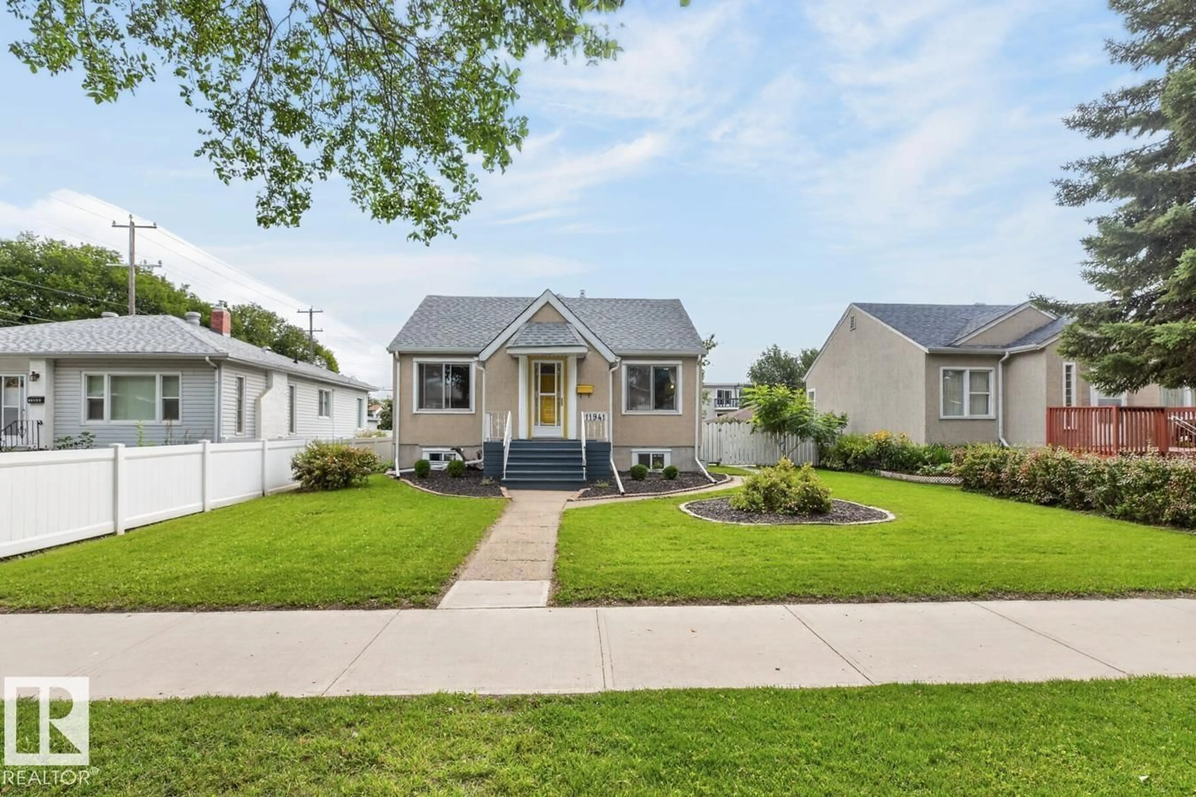 Home with vinyl exterior material, street for NW - 11941 83 ST, Edmonton Alberta T5B4E7