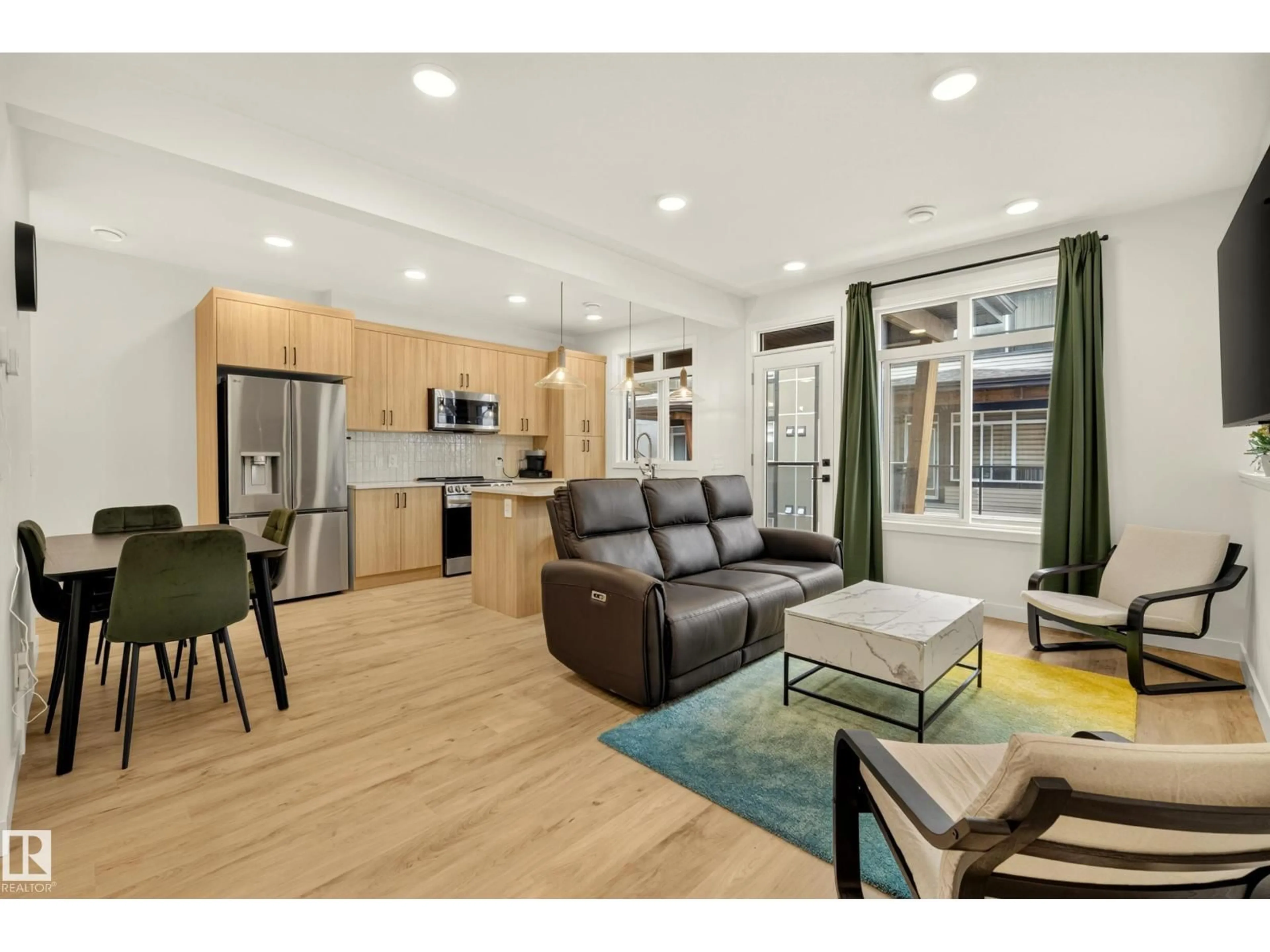 Open concept kitchen, wood/laminate floor for 53 16231 19 AV SW, Edmonton Alberta T6W5C6