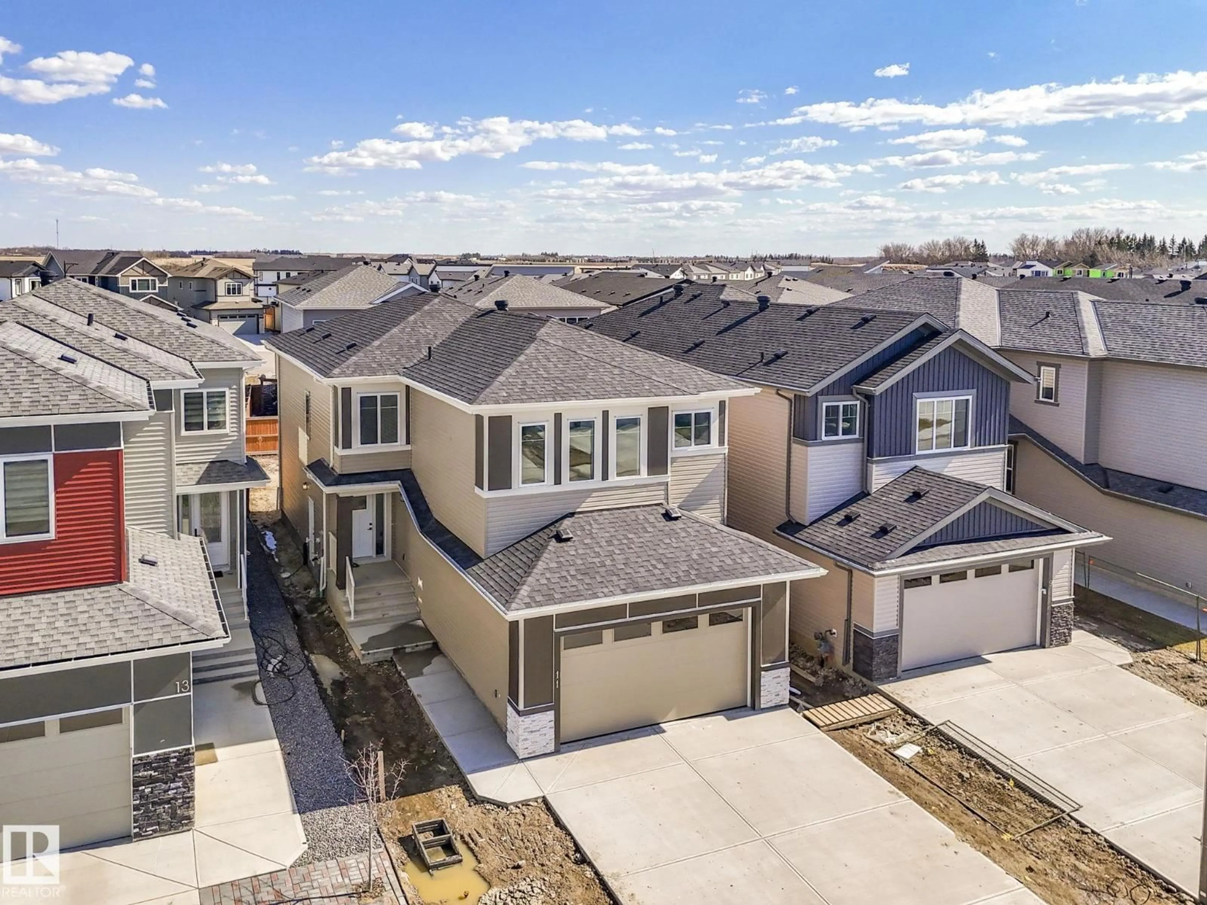 A pic from outside/outdoor area/front of a property/back of a property/a pic from drone, street for 11 DALQUIST BAY, Leduc Alberta T9E1N7