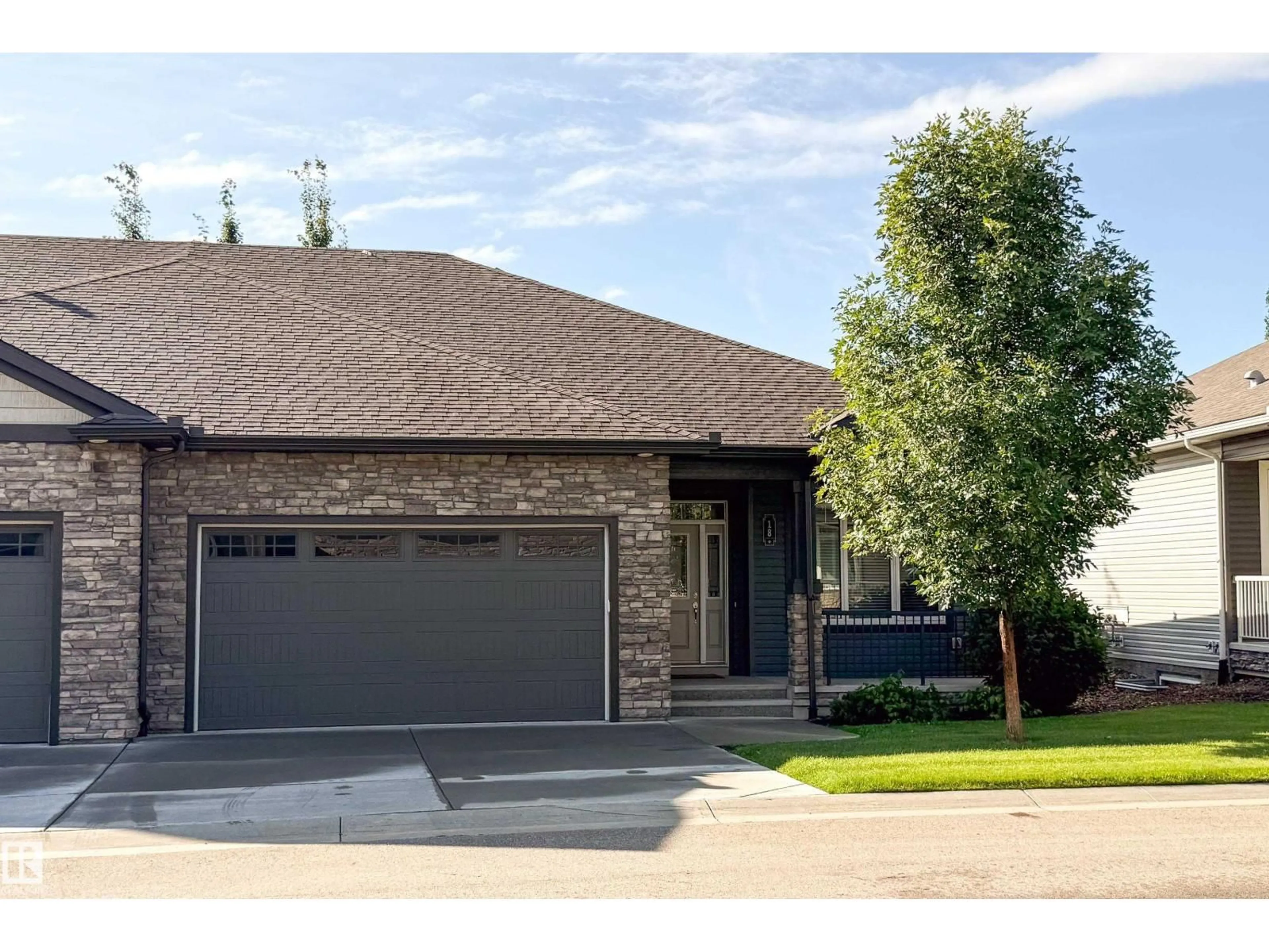 Home with brick exterior material, street for 7115 - 18 ARMOUR LINK LI, Edmonton Alberta T6W2V2