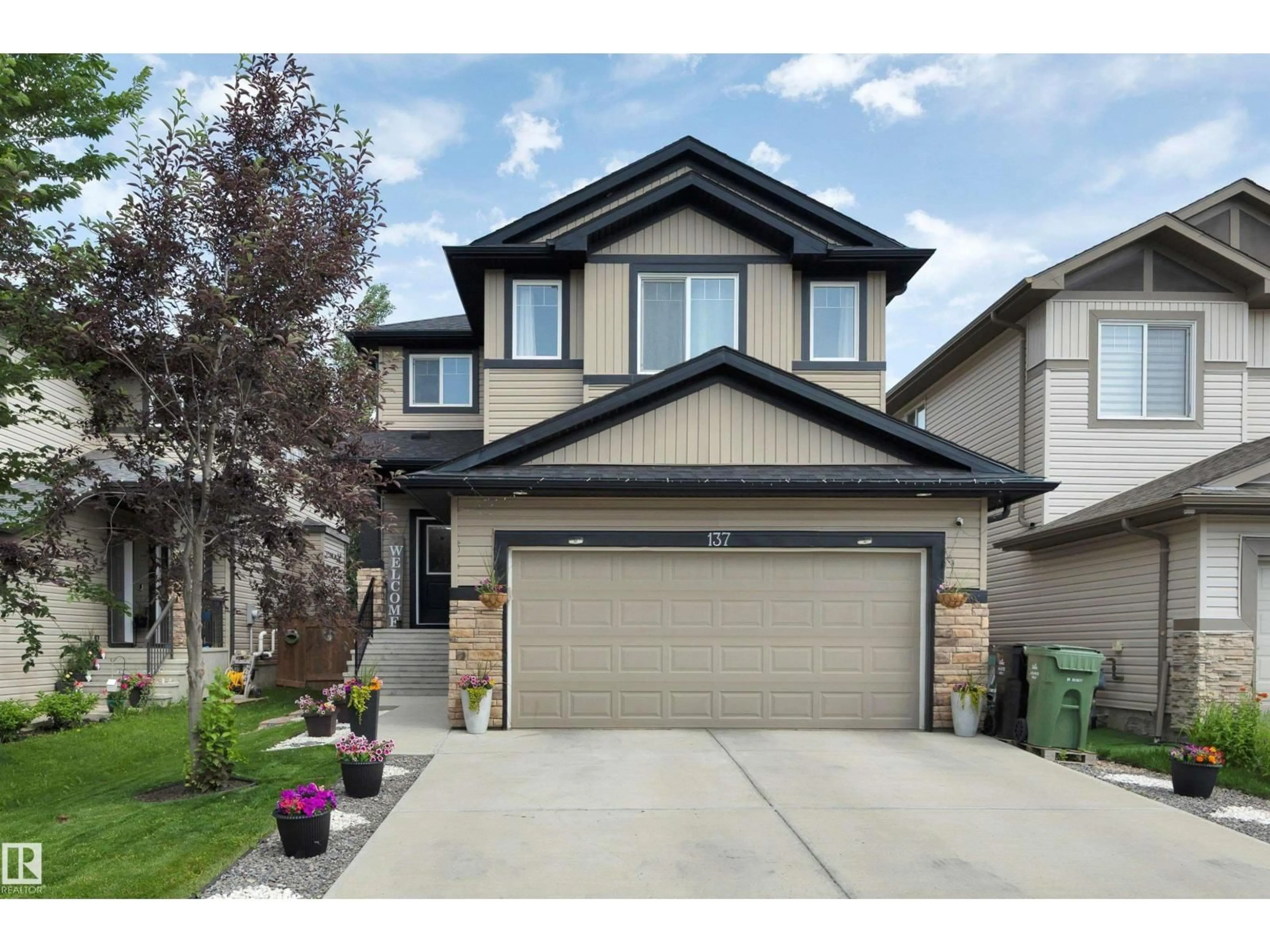 Home with vinyl exterior material, street for 137 AWENTIA ST, Leduc Alberta T9E1H4