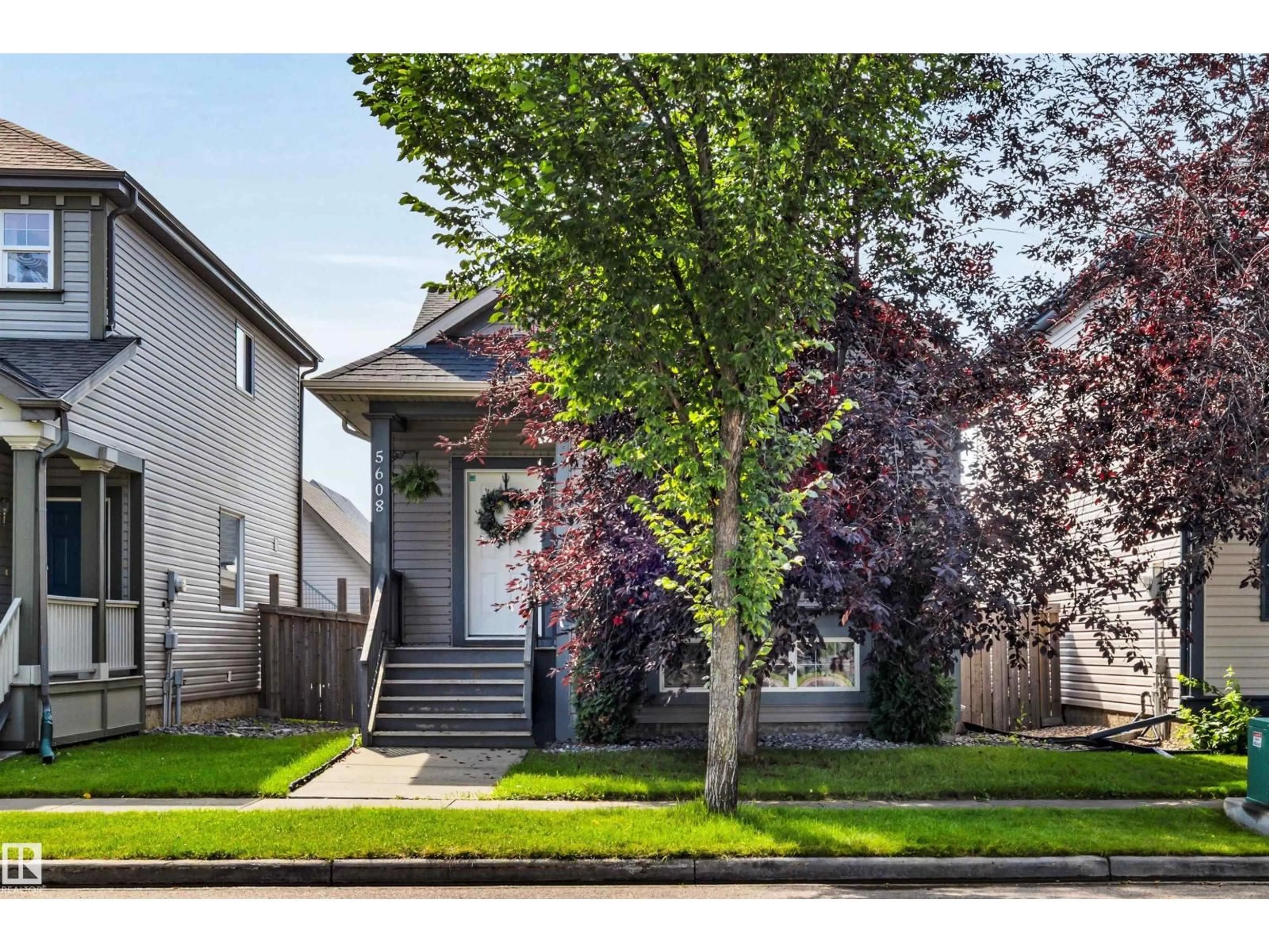 Home with vinyl exterior material, street for 5608 STEVENS CR, Edmonton Alberta T6R0A4