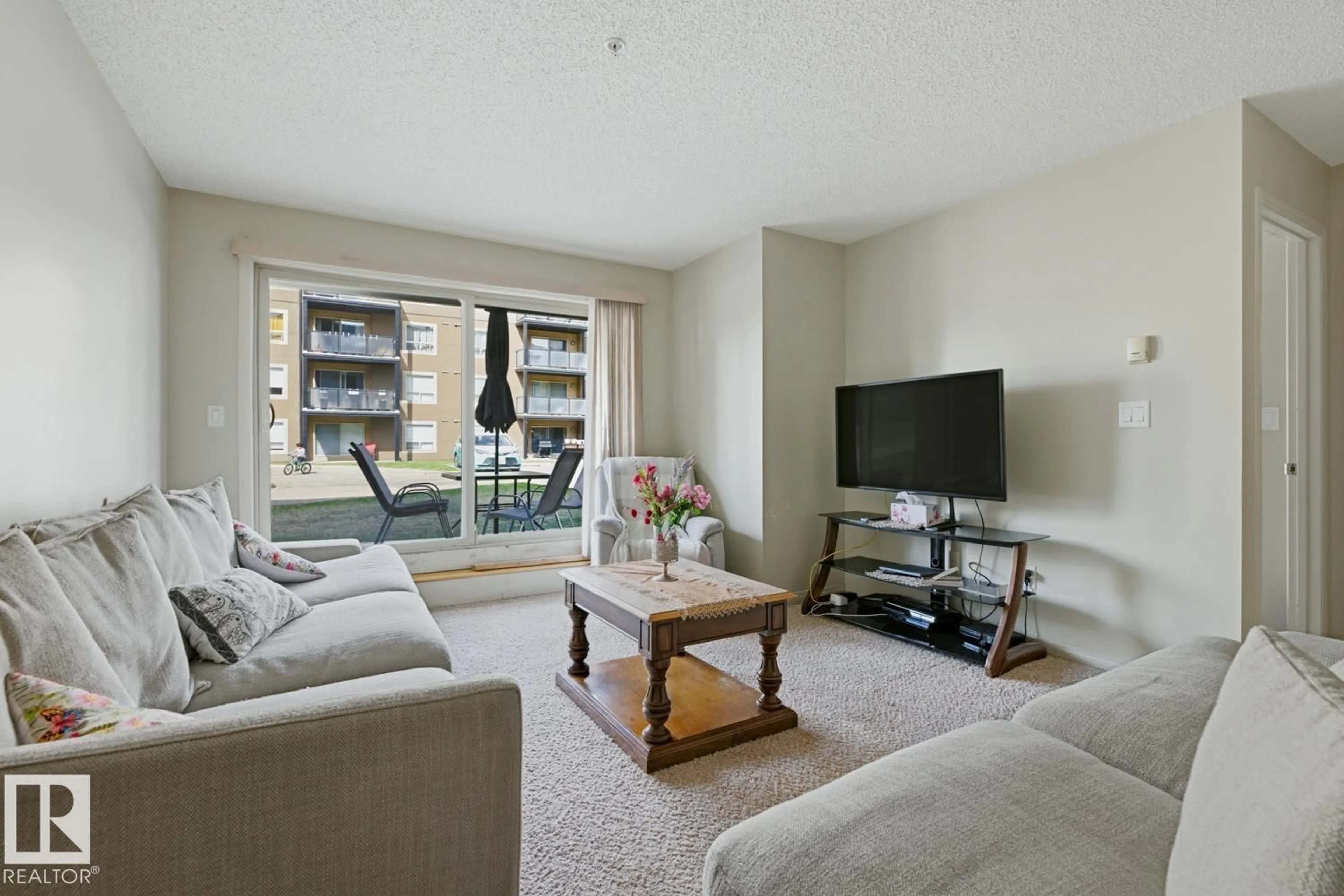 Living room with furniture, unknown for #106 - 13907 136 ST, Edmonton Alberta T6V1Y5