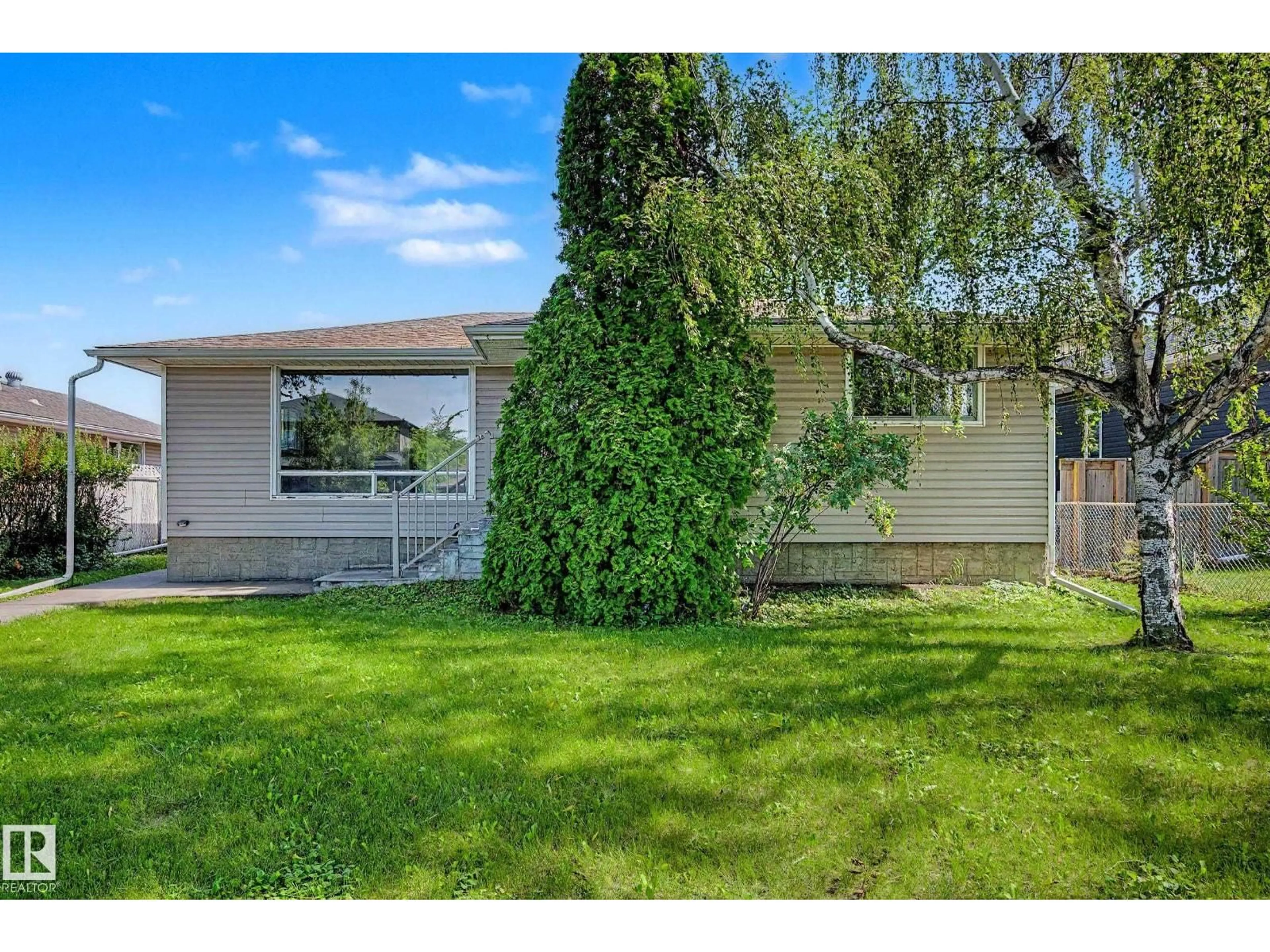 Home with vinyl exterior material, street for 9723 76 ST, Edmonton Alberta T6C2L1