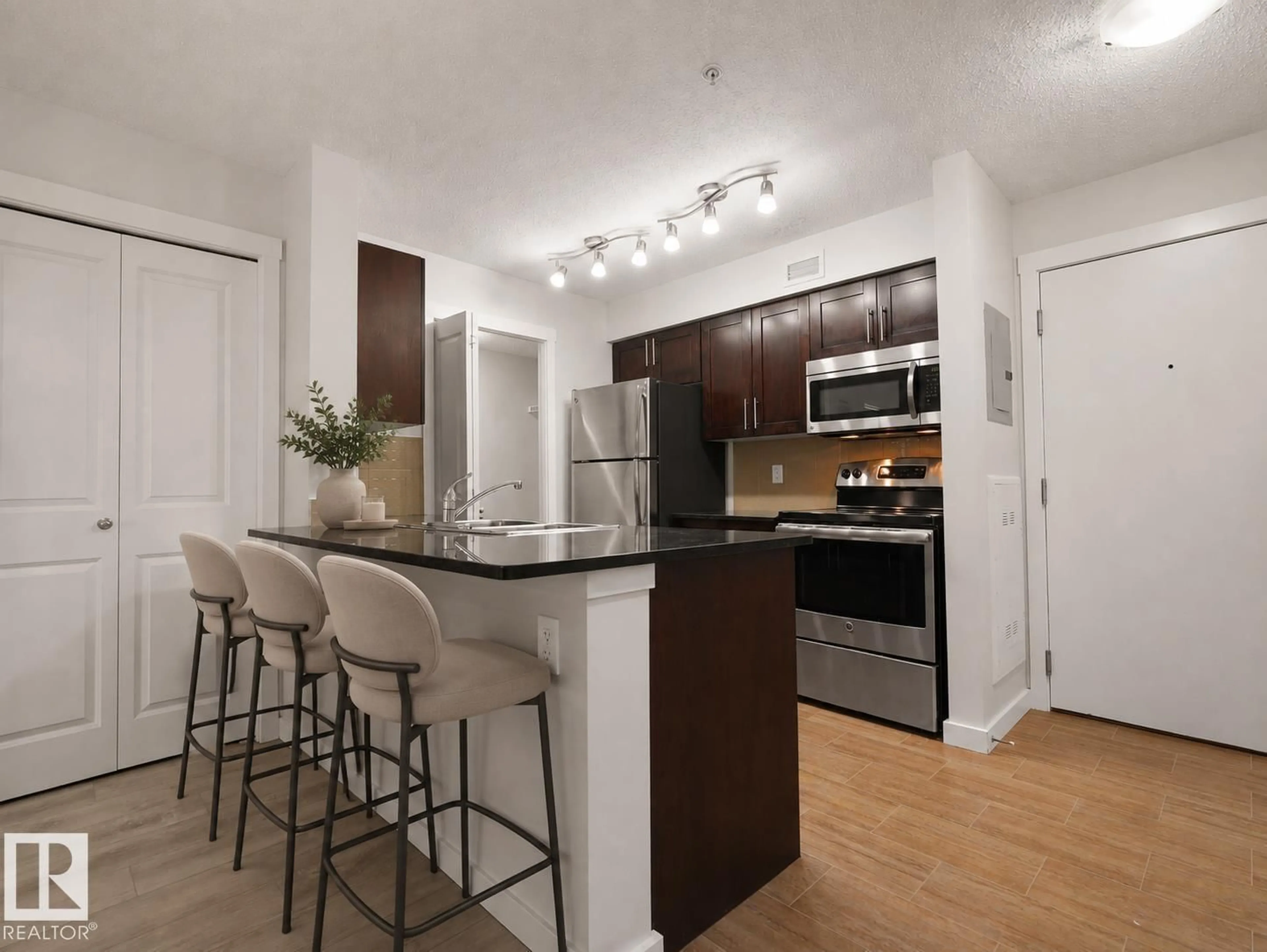 Standard kitchen, wood/laminate floor for #205 - 5816 MULLEN PL, Edmonton Alberta T6R0W3
