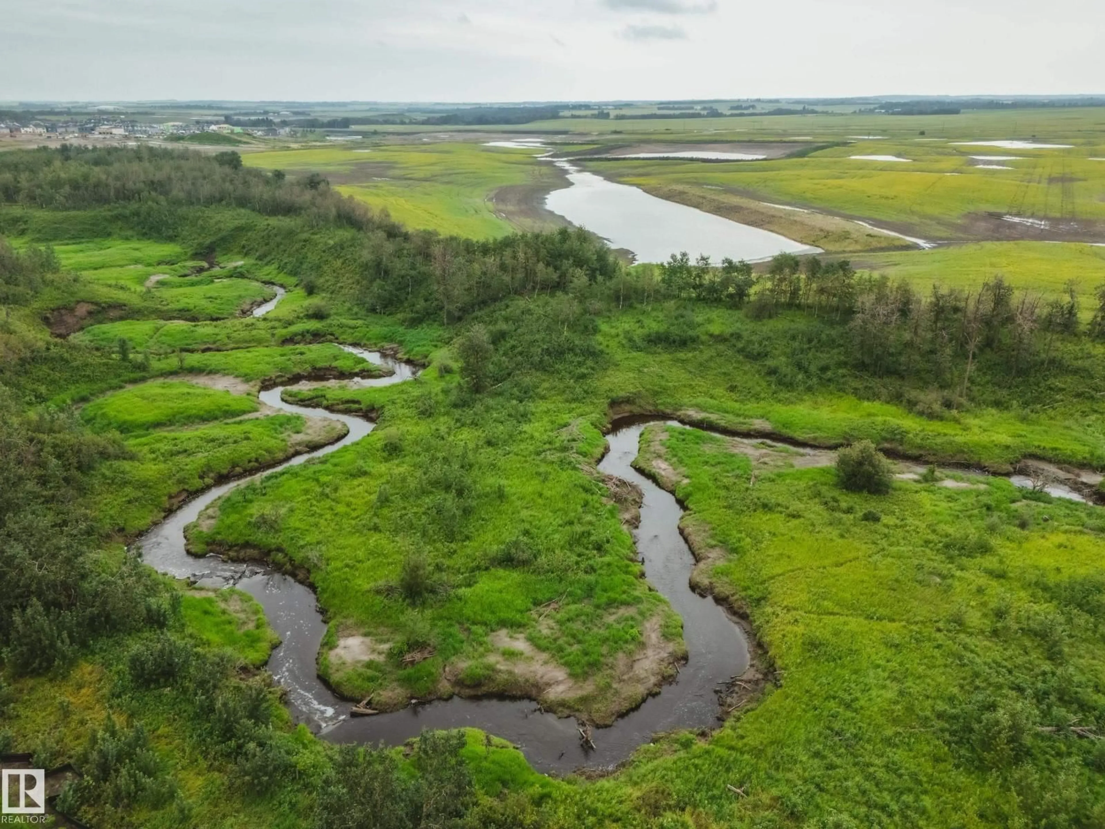 A pic from outside/outdoor area/front of a property/back of a property/a pic from drone, water/lake/river/ocean view for 25 BROOKSIDE DR, Sherwood Park Alberta T8H3B2