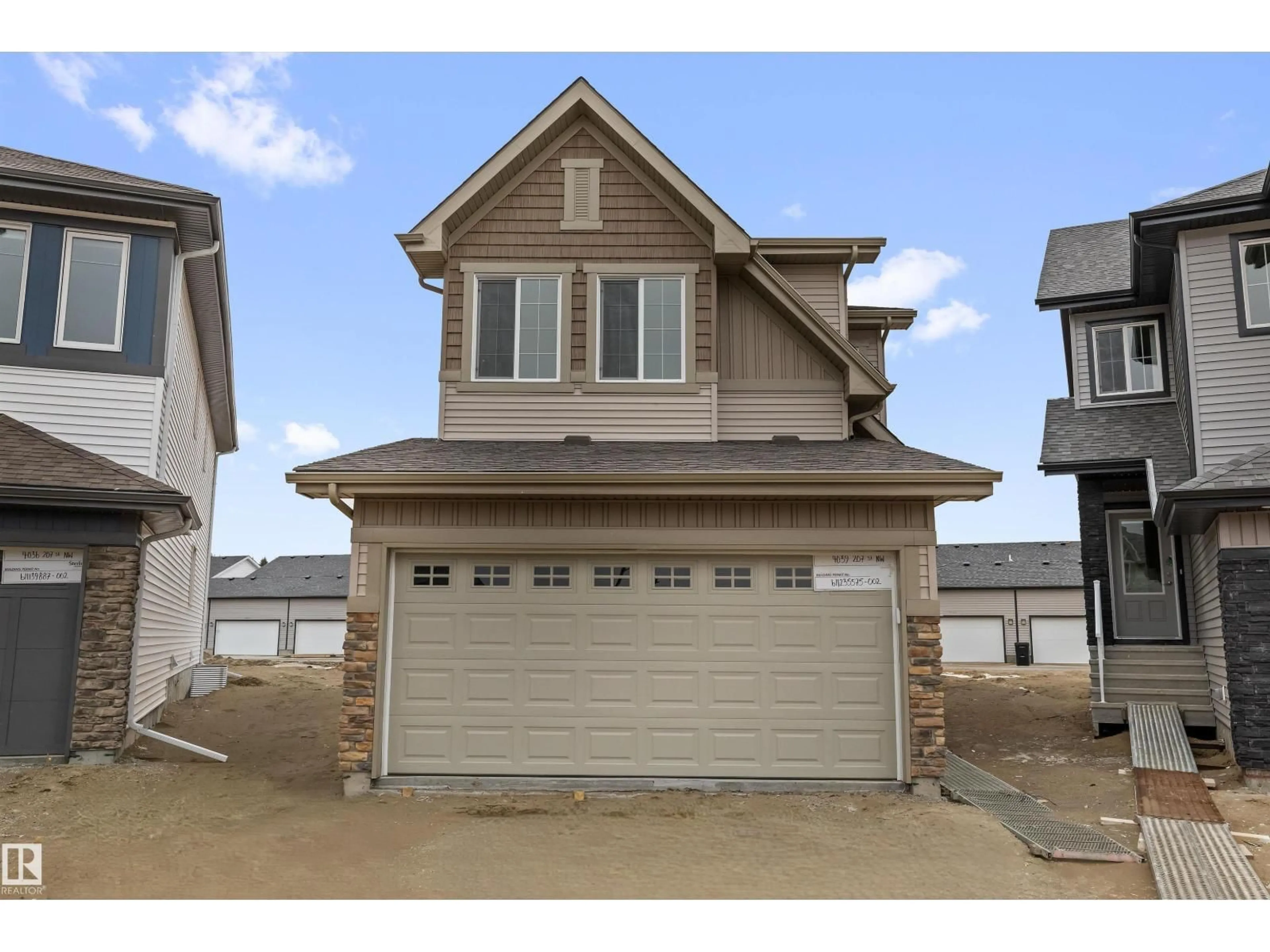 Home with vinyl exterior material, street for NW - 4039 207 ST, Edmonton Alberta T6M3G1