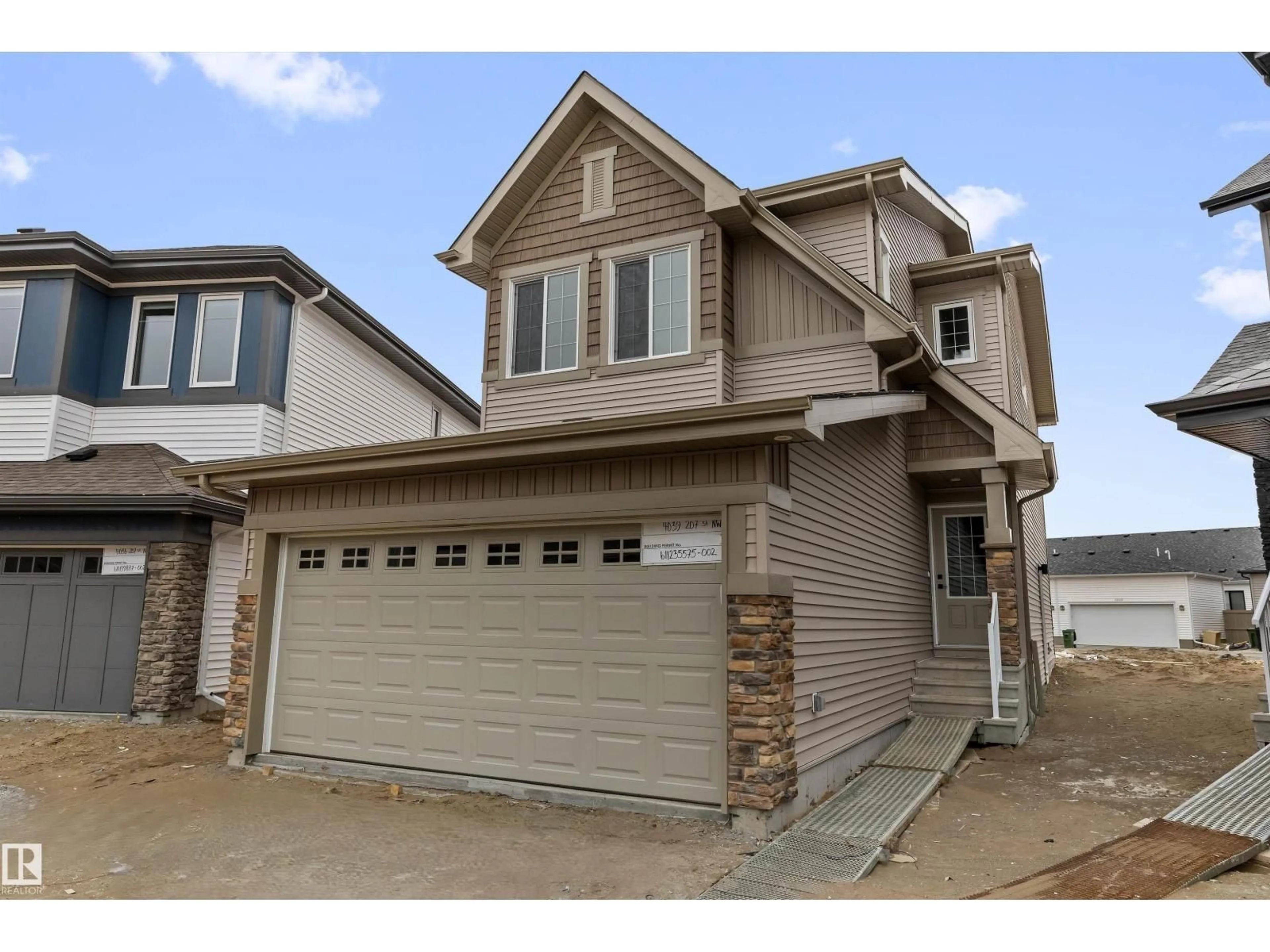 Home with vinyl exterior material, street for NW - 4039 207 ST, Edmonton Alberta T6M3G1