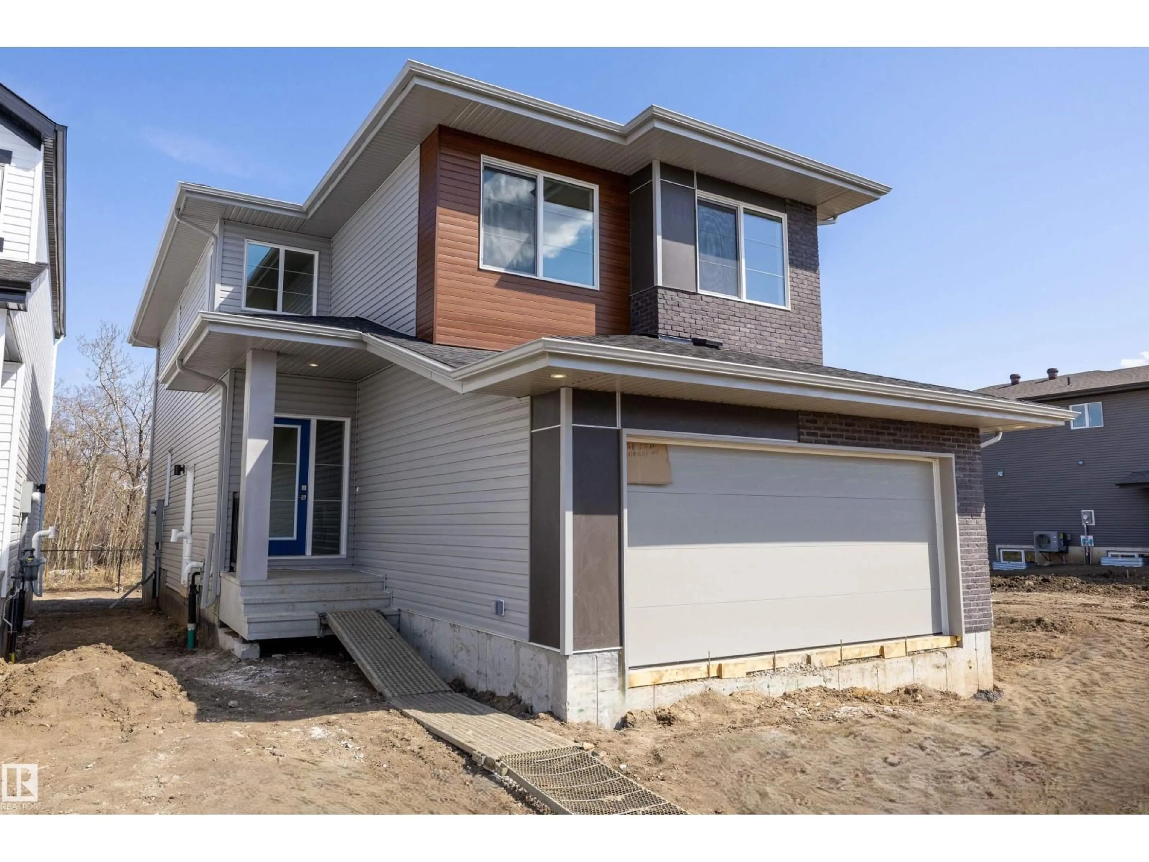 Home with vinyl exterior material, street for NE - 17611 7 ST, Edmonton Alberta T5Y4K3