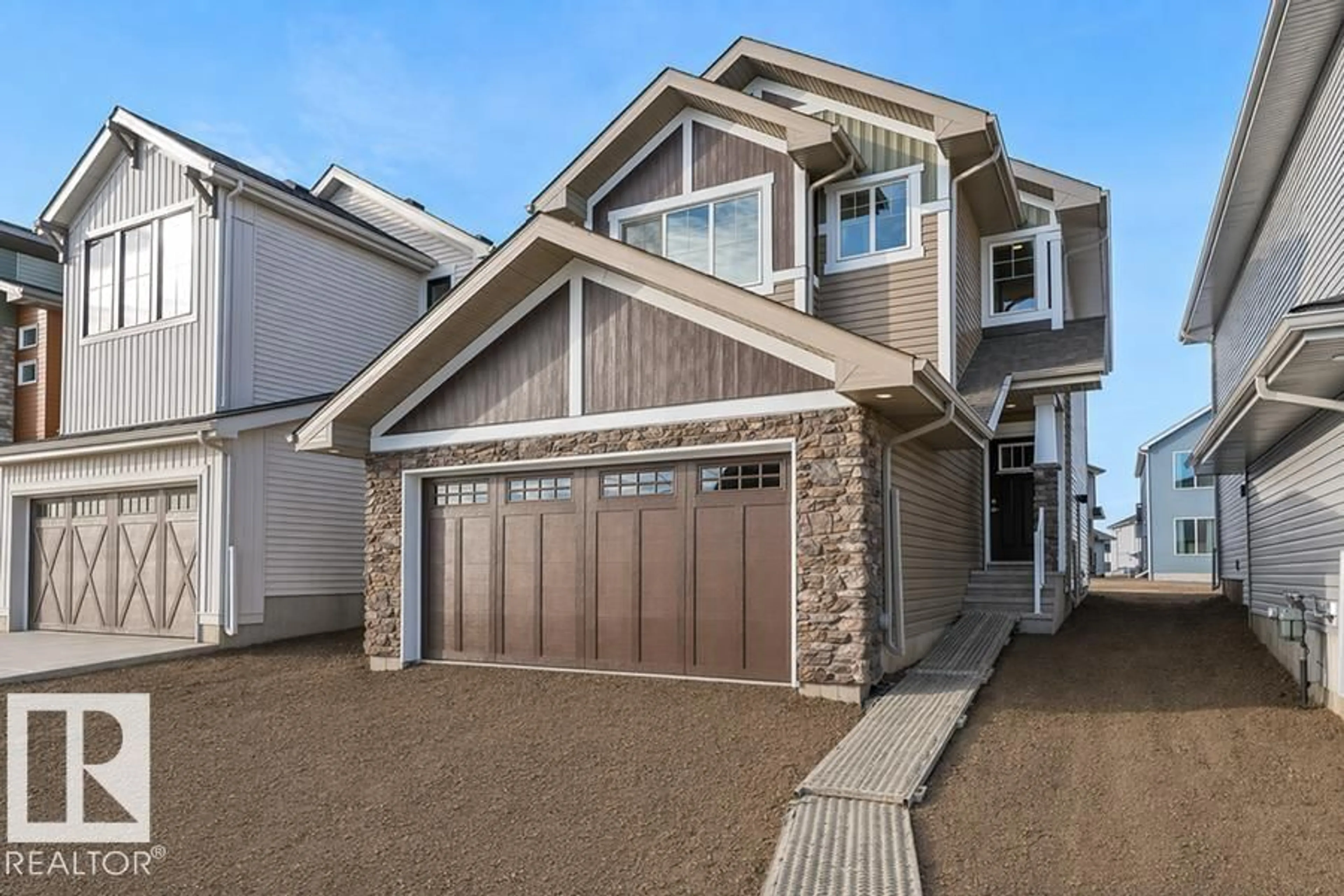 Home with vinyl exterior material, street for 2812 190 ST, Edmonton Alberta T6M3H8