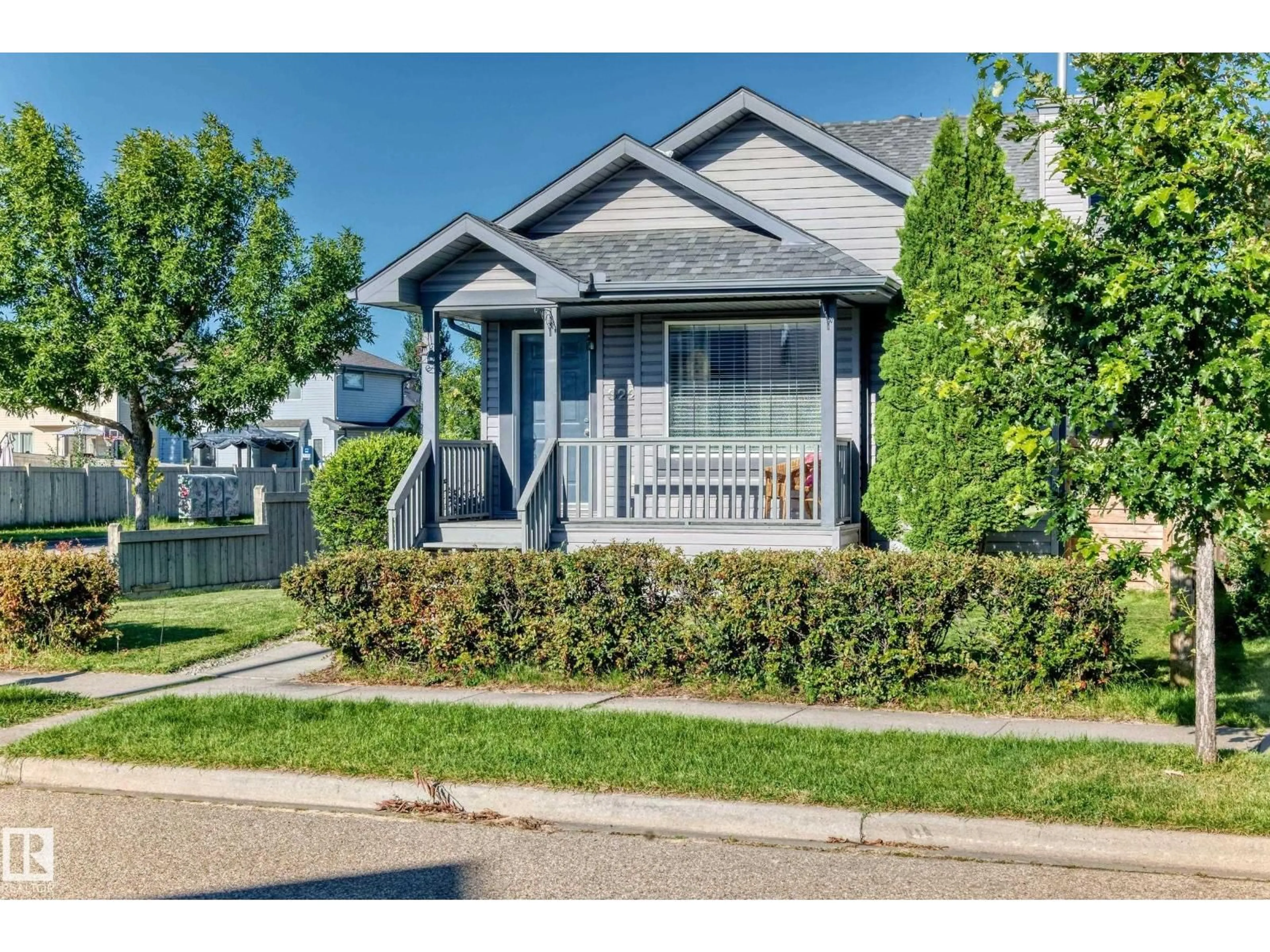 Home with vinyl exterior material, street for 322 84 ST, Edmonton Alberta T6X1H8