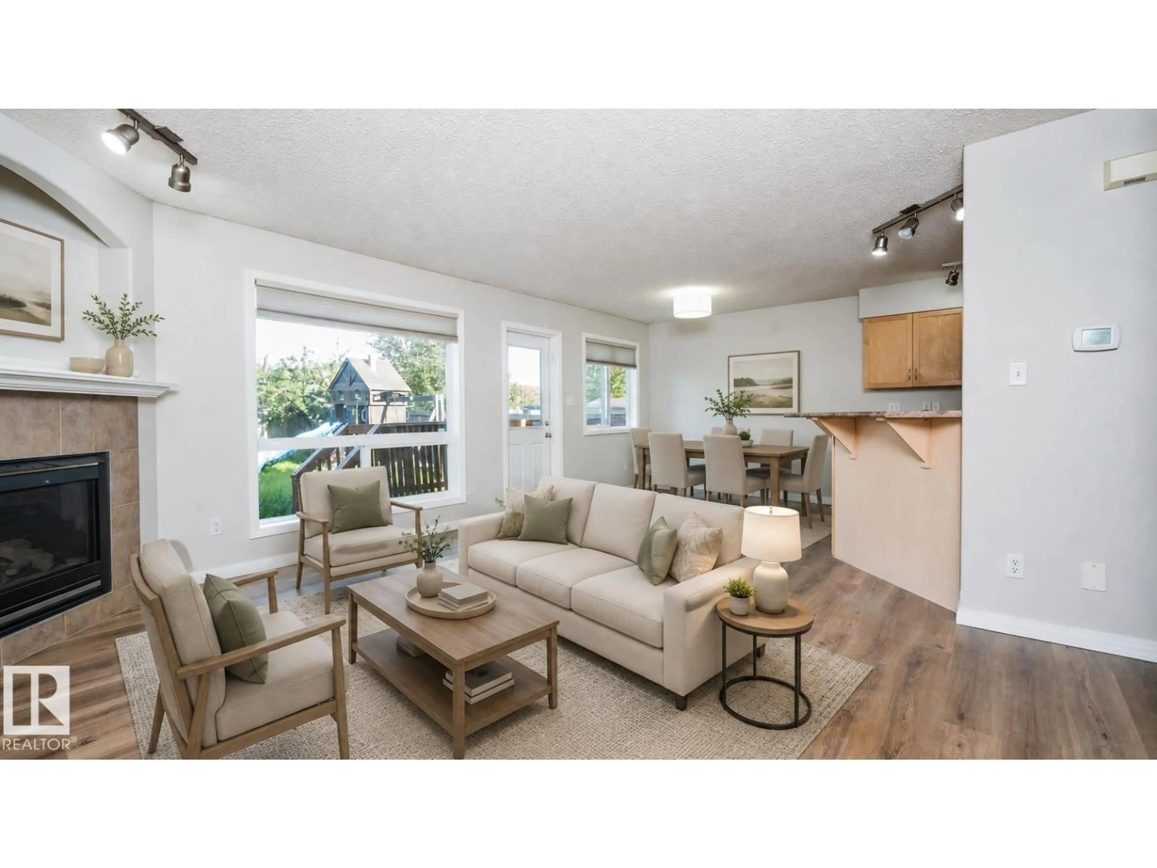 Living room with furniture, wood/laminate floor for 1009 MACEWAN CL, Edmonton Alberta T6W1K2