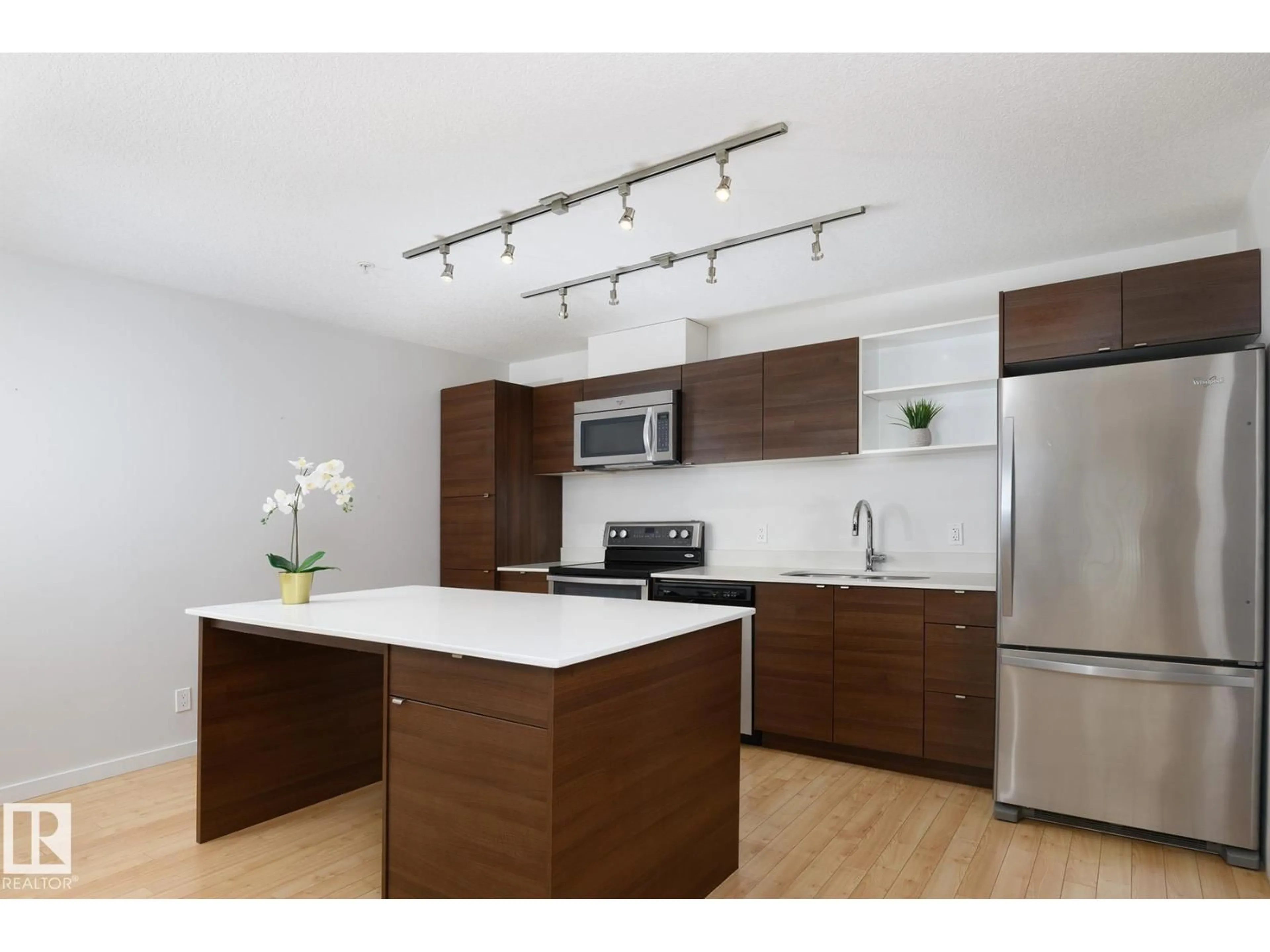 Open concept kitchen, wood/laminate floor for 110 9523 160 AV NW, Edmonton Alberta T5Z0N1