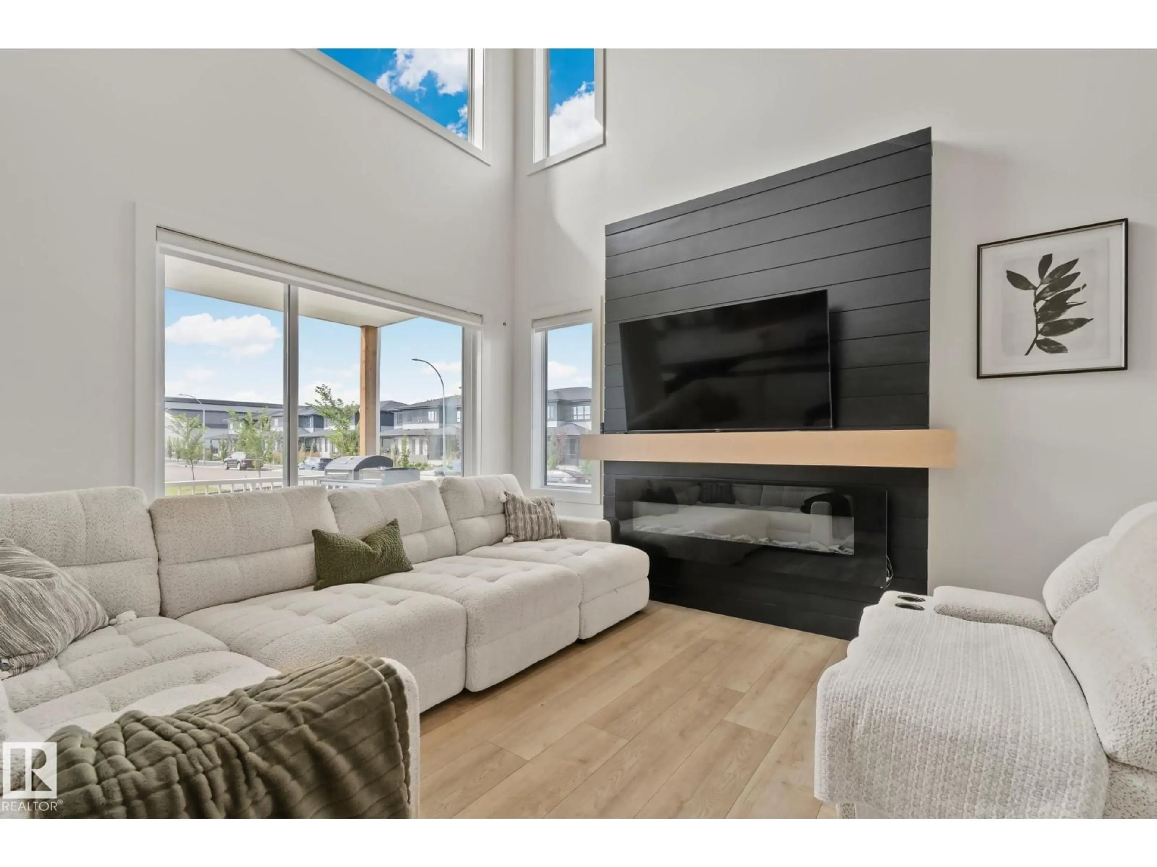 Living room with furniture, wood/laminate floor for 1 STARLING WY, Fort Saskatchewan Alberta T8L0Y1