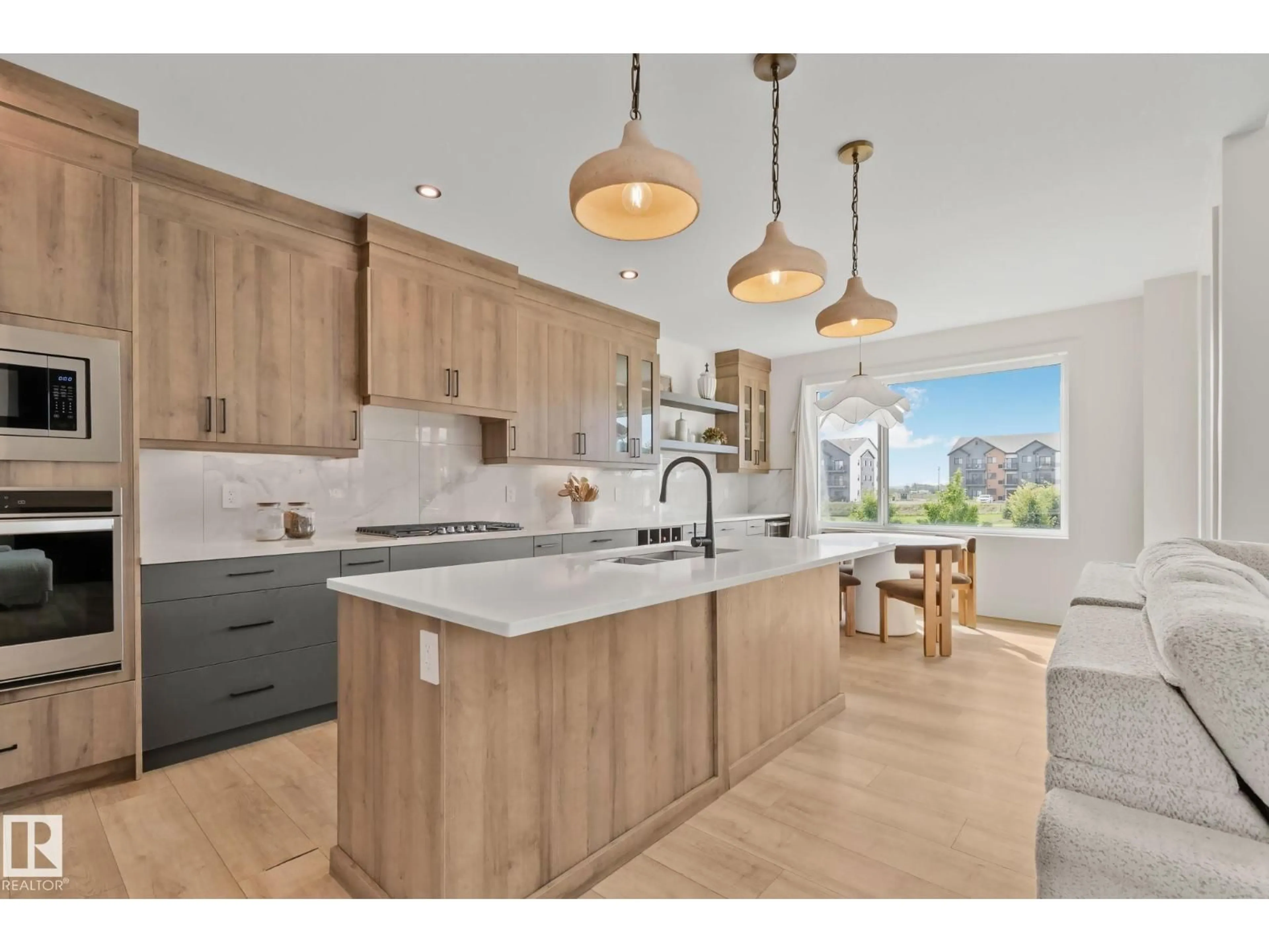 Open concept kitchen, wood/laminate floor for 1 STARLING WY, Fort Saskatchewan Alberta T8L0Y1