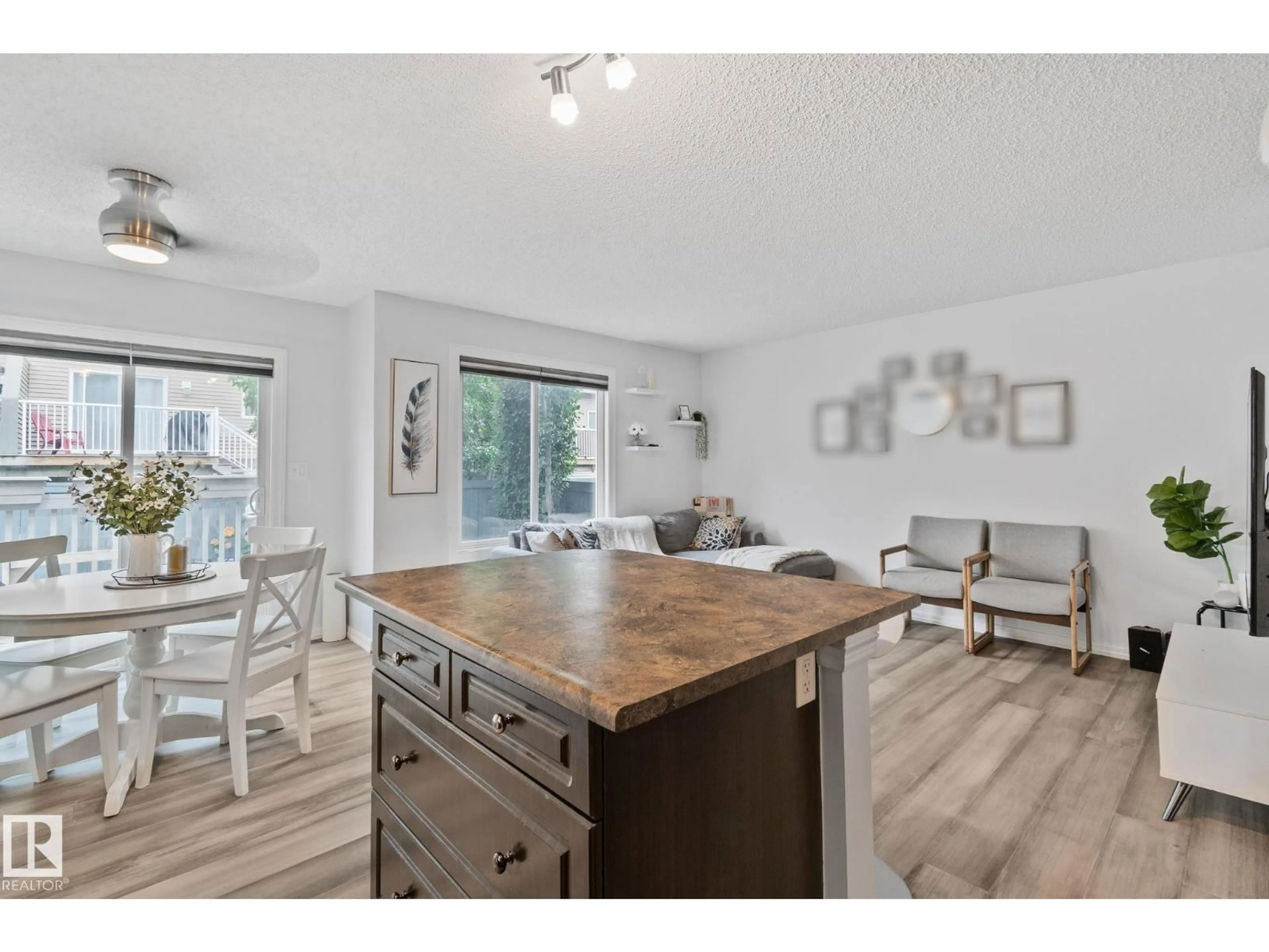 Open concept kitchen, wood/laminate floor for 5101 - 20 SOLEIL BV, Beaumont Alberta T4X0E3