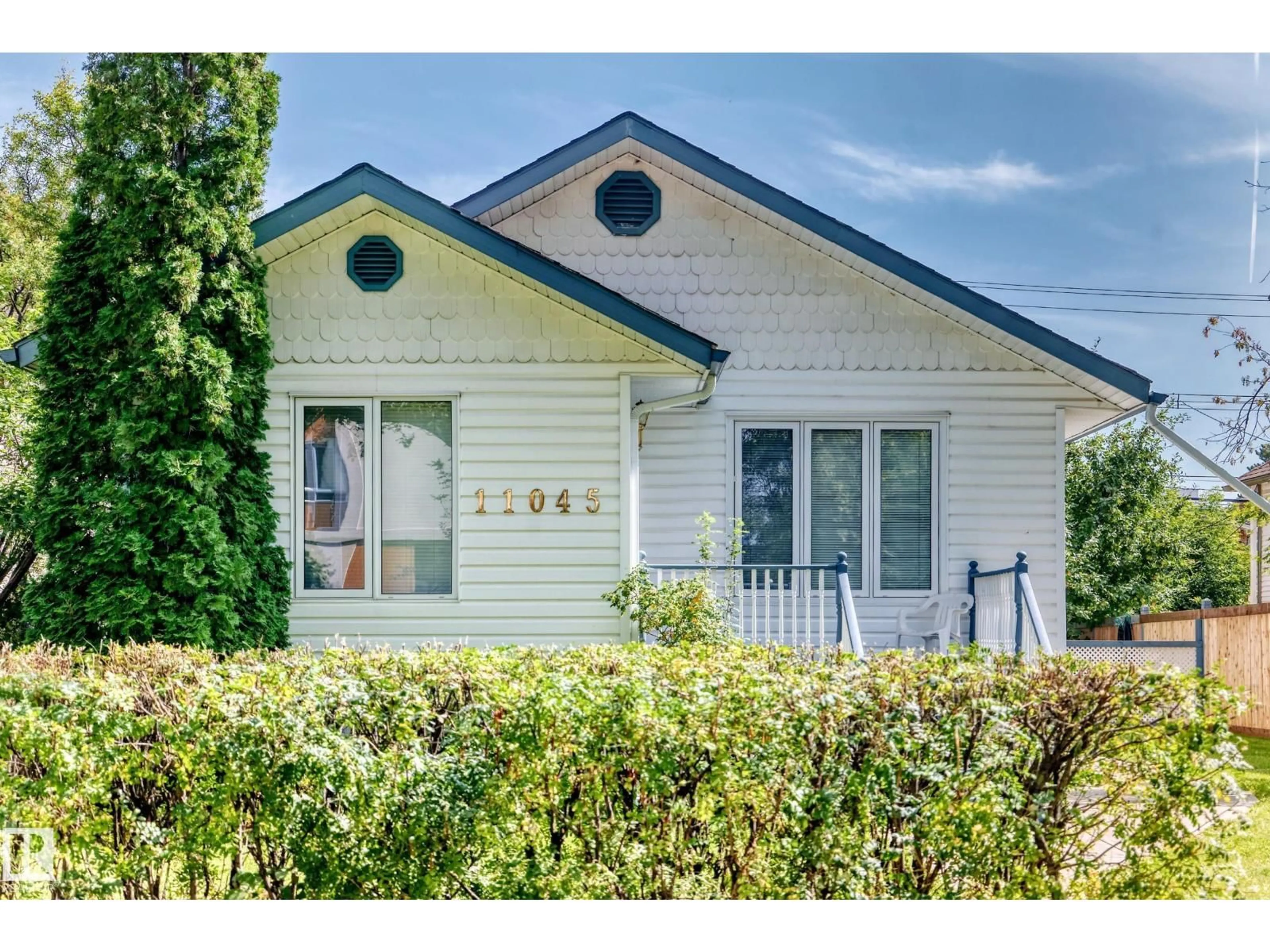 Home with vinyl exterior material, street for NW - 11045 125 ST, Edmonton Alberta T5M0M2