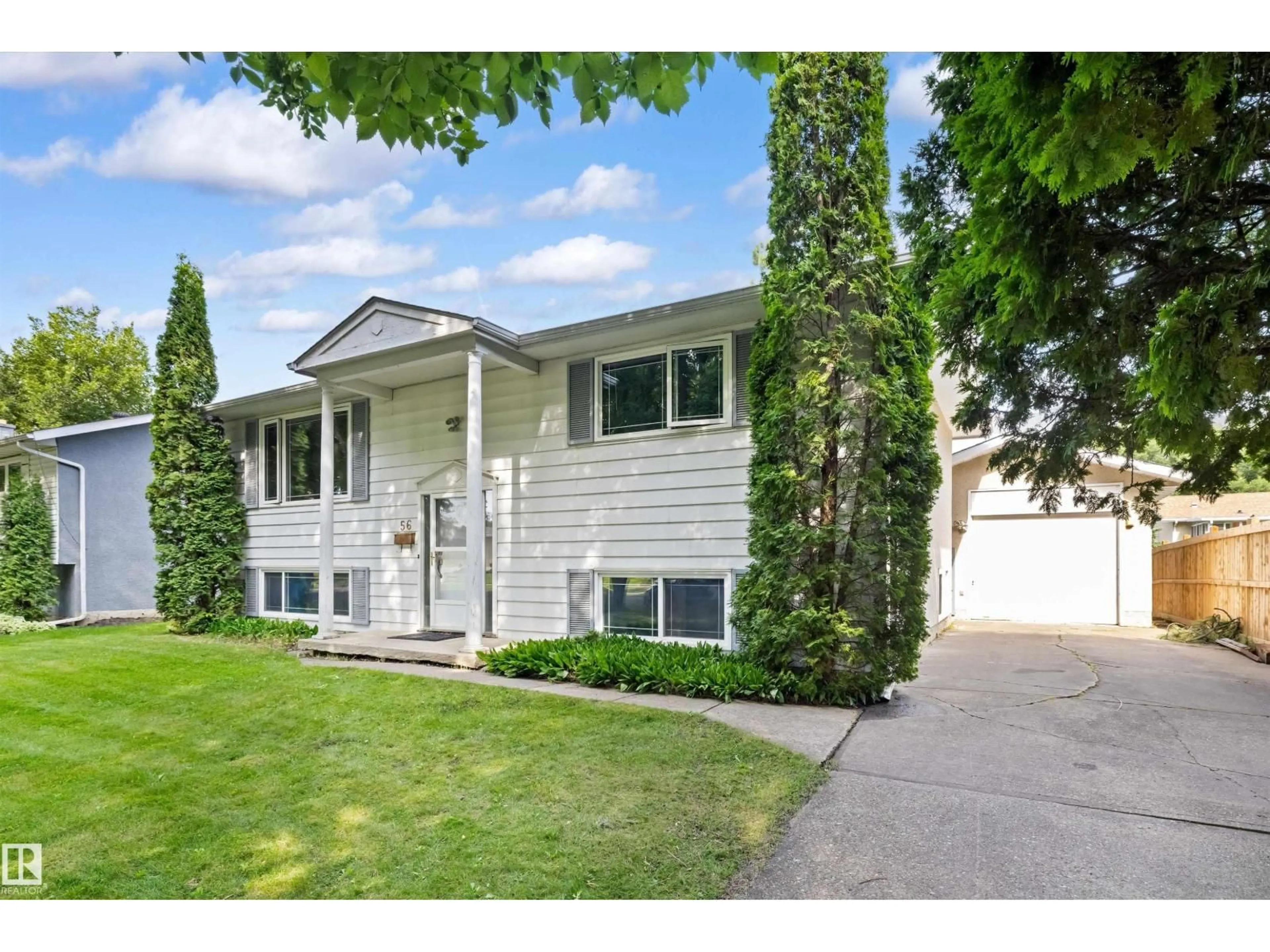 Home with vinyl exterior material, street for 56 FLAGSTONE CR, St. Albert Alberta T8N1R3