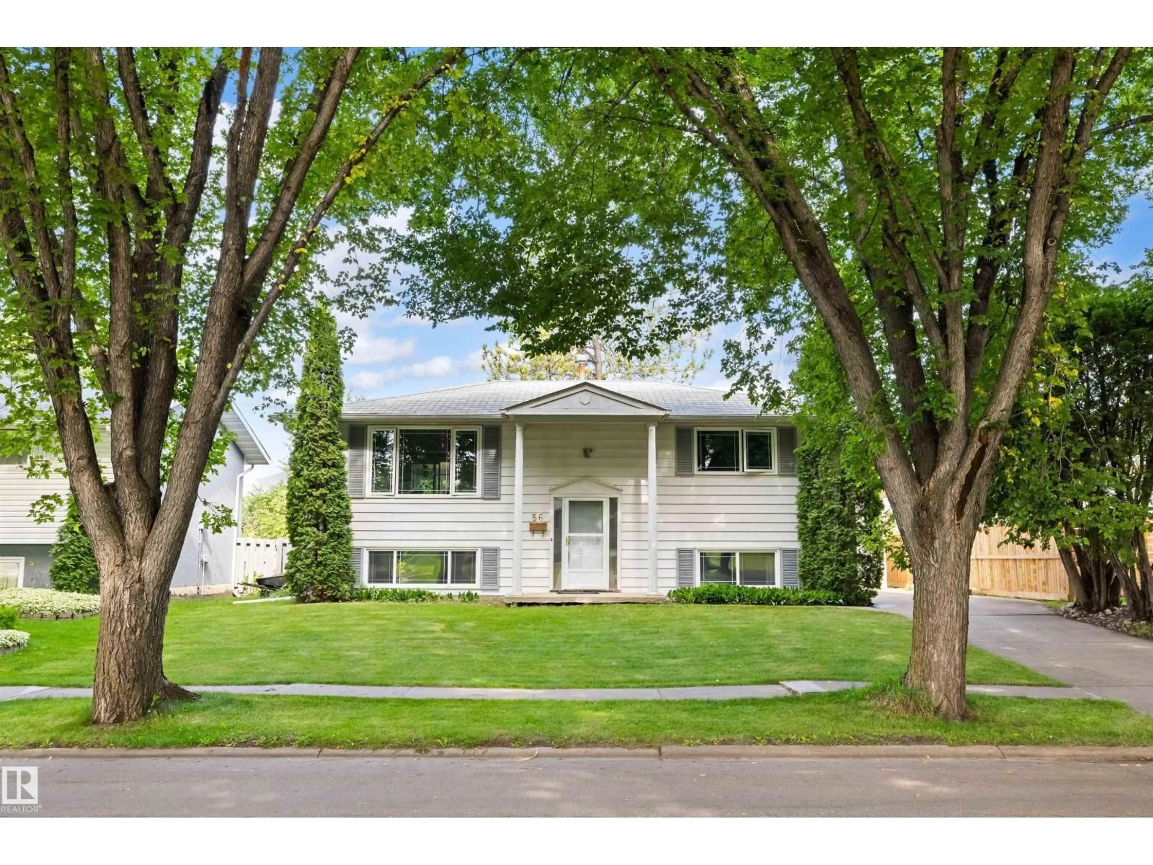 Home with vinyl exterior material, street for 56 FLAGSTONE CR, St. Albert Alberta T8N1R3