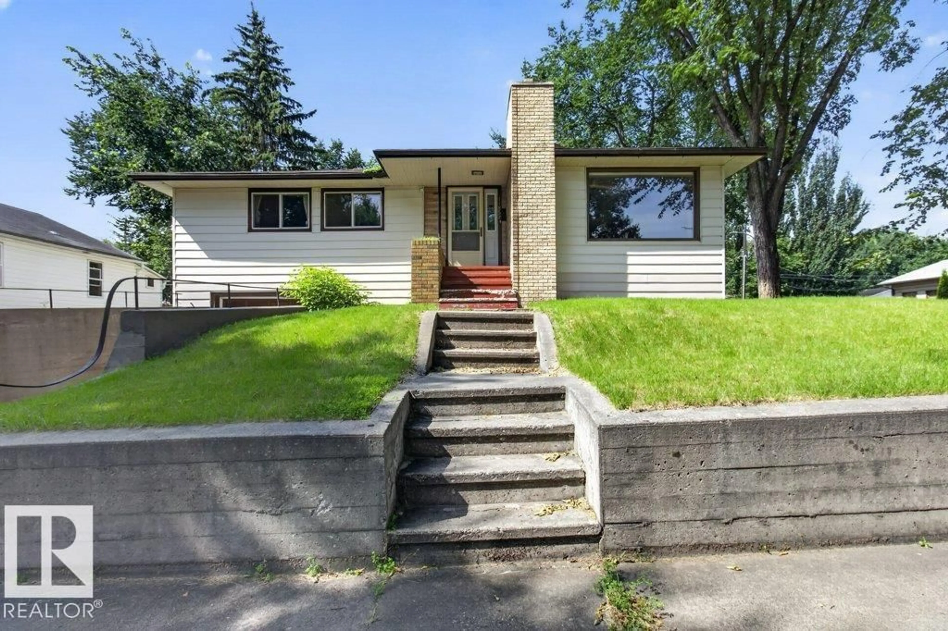 Home with vinyl exterior material, street for NW - 11852 55 ST, Edmonton Alberta T5W3P8