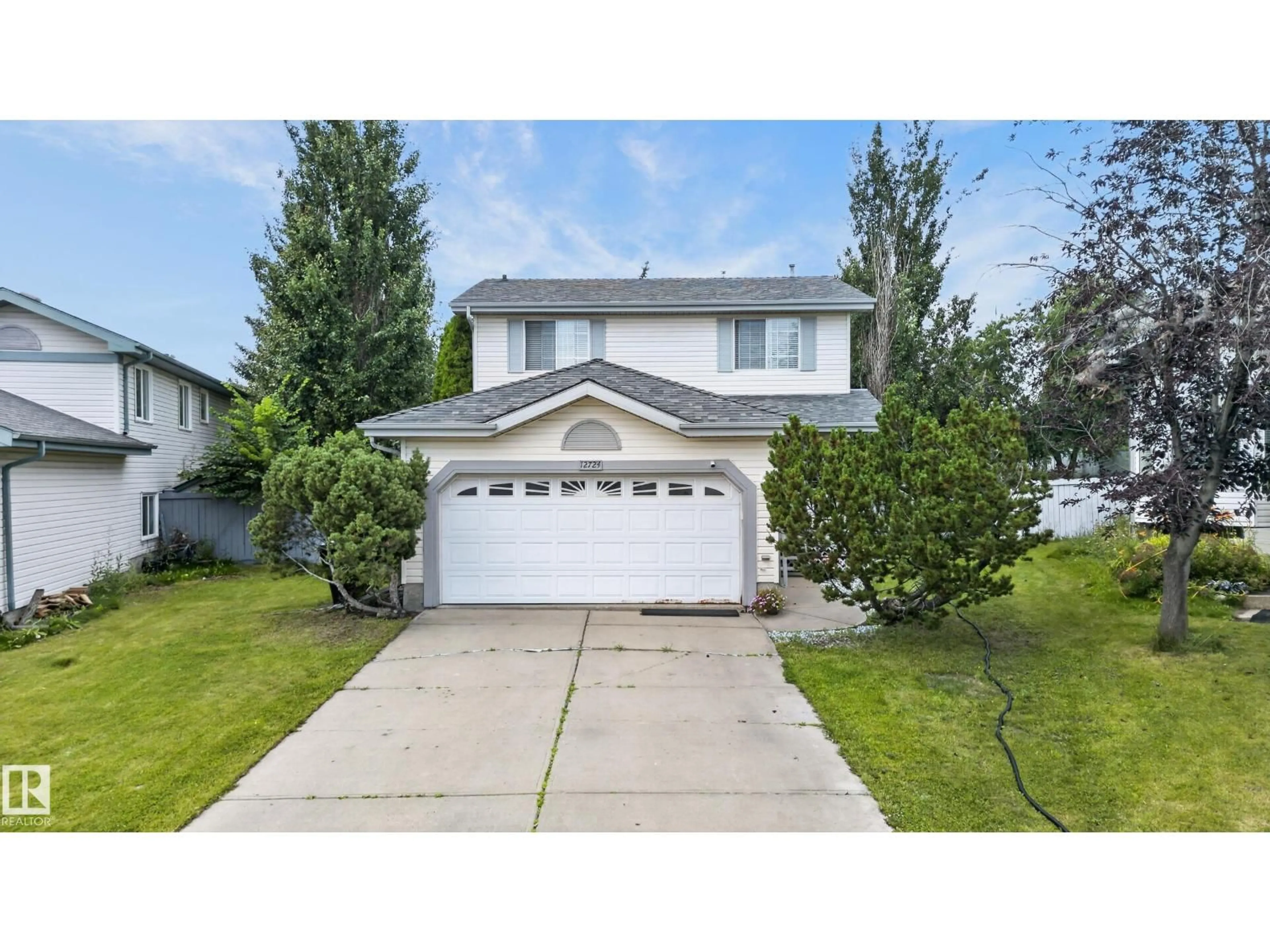 Home with vinyl exterior material, street for 12724 148 AV, Edmonton Alberta T6V1C4
