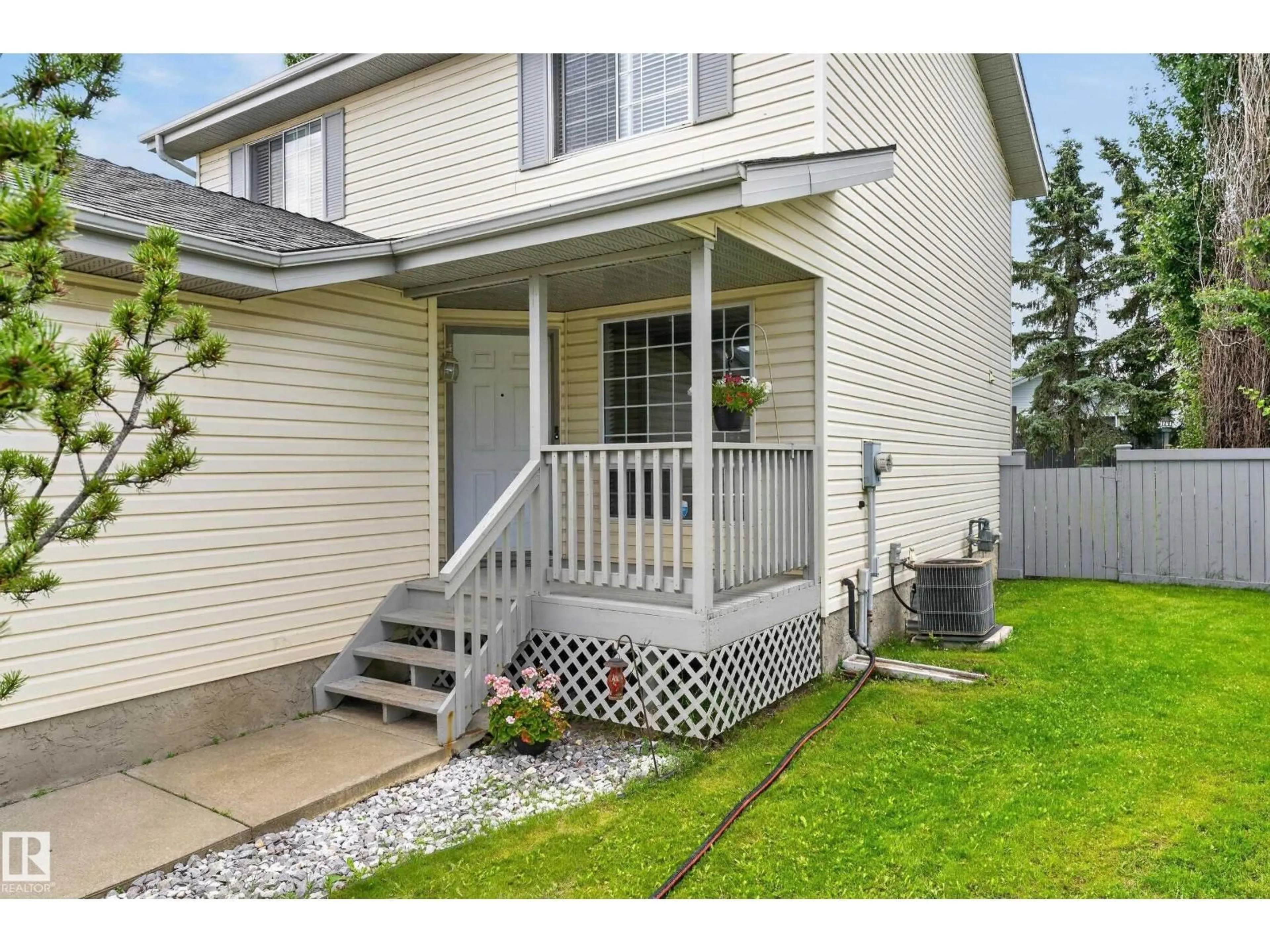 Home with vinyl exterior material, street for 12724 148 AV, Edmonton Alberta T6V1C4
