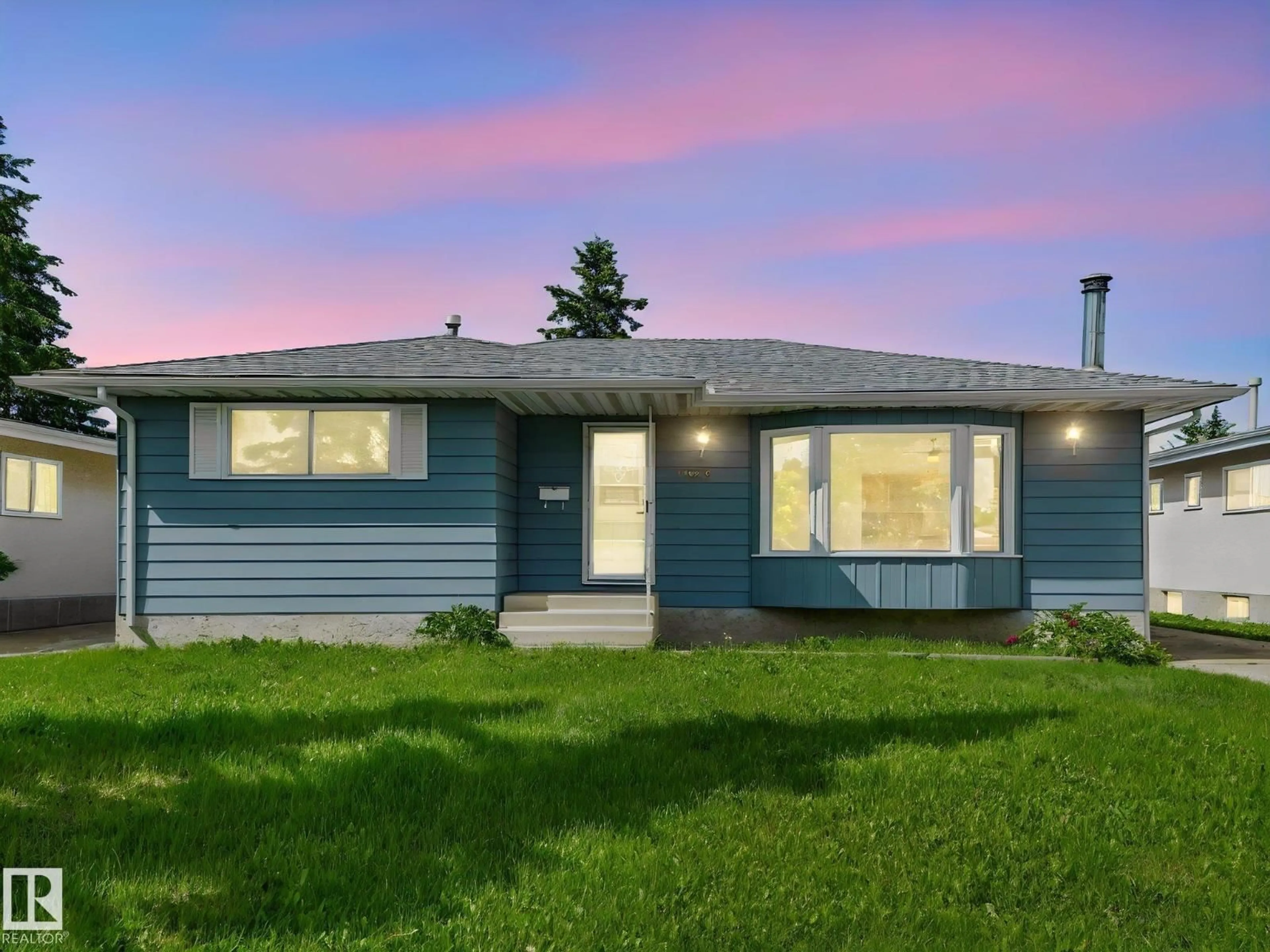 Home with vinyl exterior material, street for 11616 158 AV, Edmonton Alberta T5X2K4